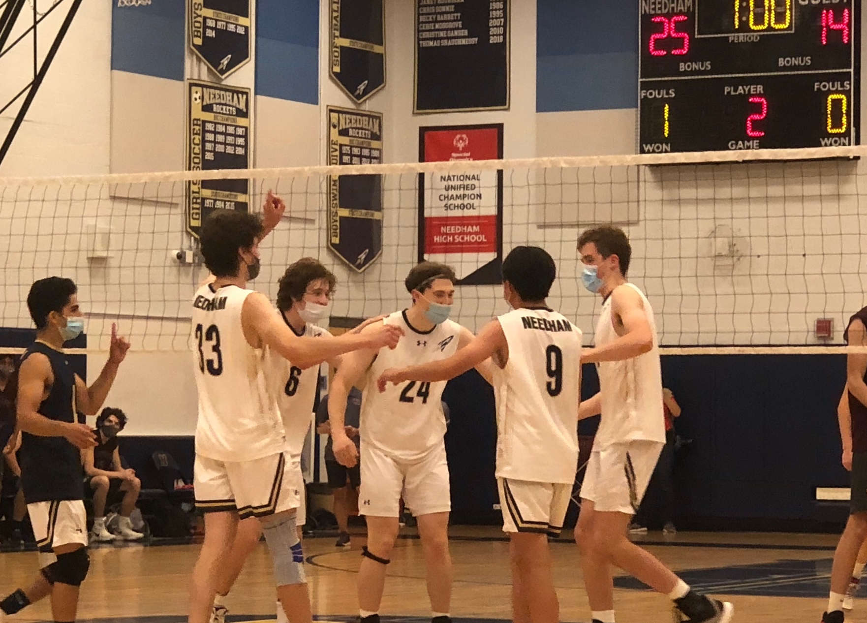 The Needham boys' volleyball celebrates a point in Wednesday's Division 1 semifinal victory over Westford.