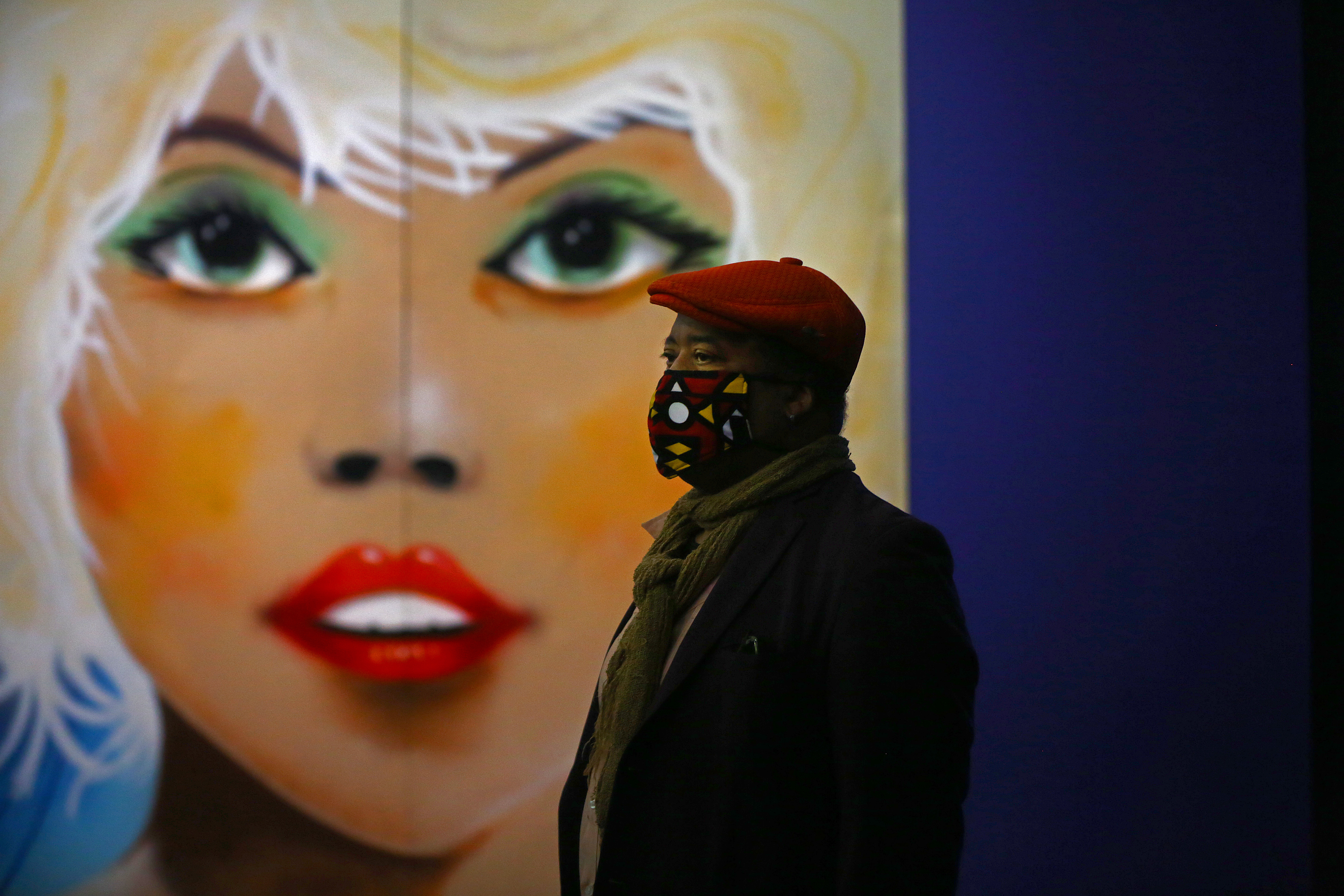 Co-curator Greg Tate walked by Lee Quiñones's 1981 portrait of Debbie Harry.
