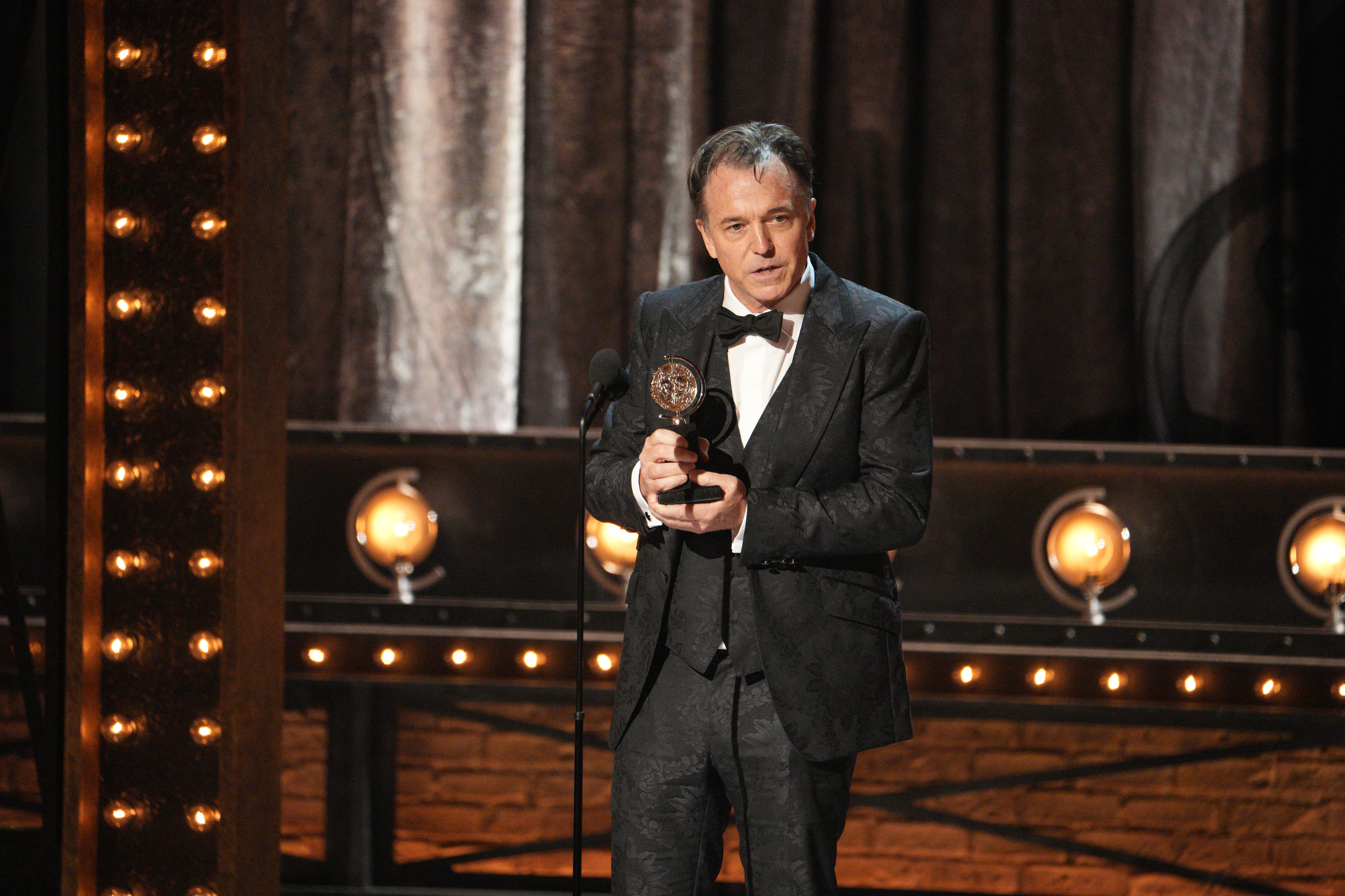Derek McLane accepted the Tony Award for best scenic design of a musical for "Moulin Rouge! The Musical."