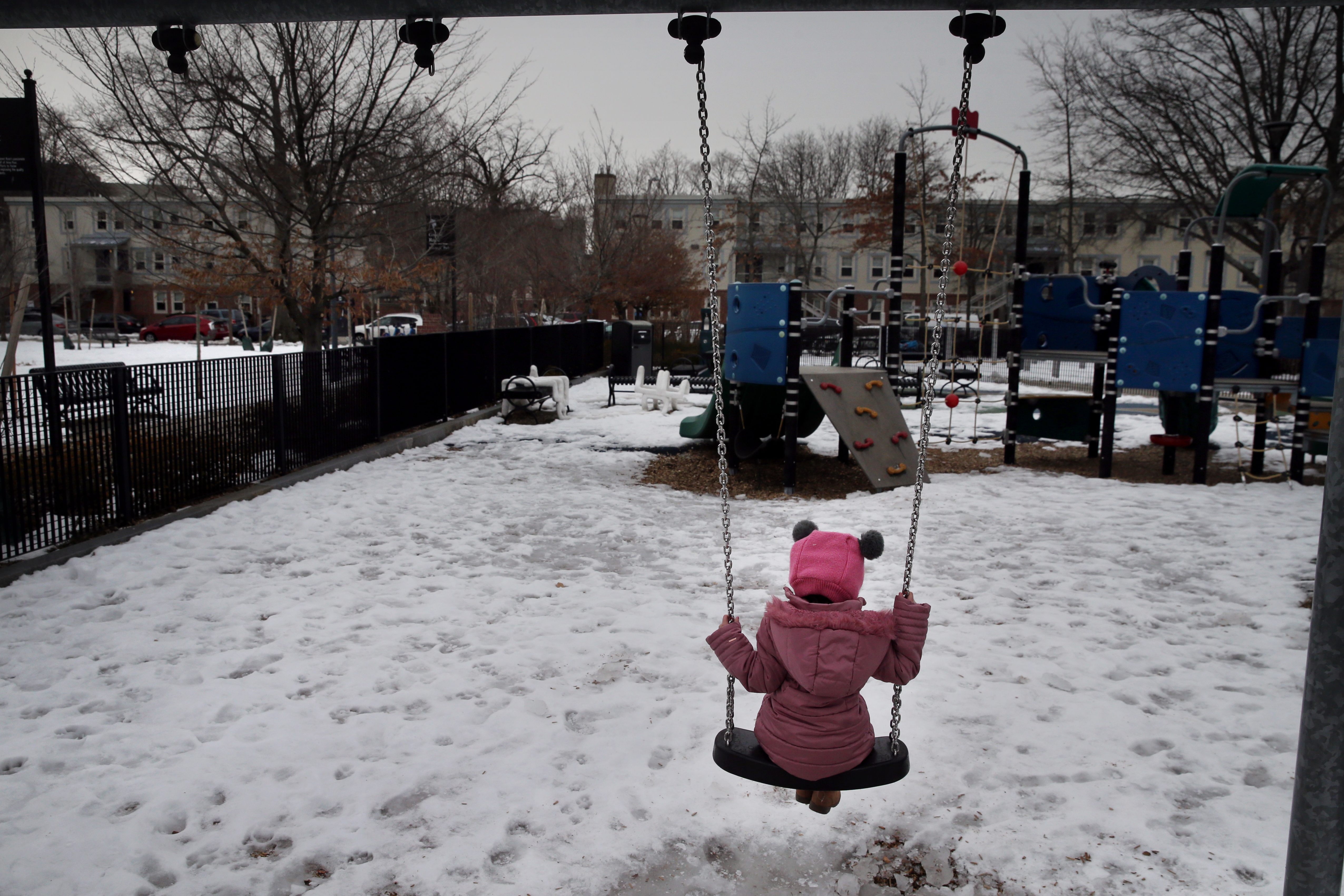 A child from the Salvation Army Our Place Day Care Center used a swing at Greene-Rose Heritage Park in the Port neighborhood of Cambridge.