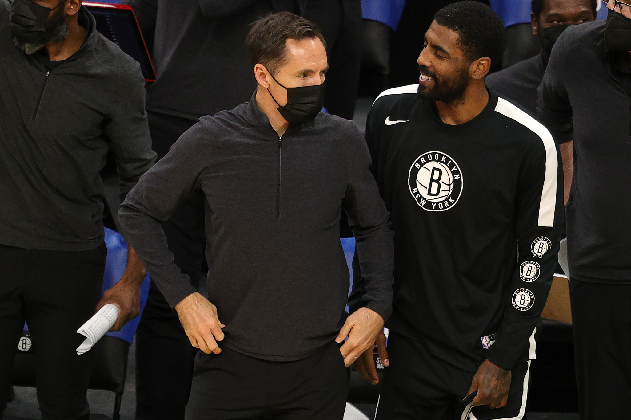 Steve Nash looks on with Kyrie Irving during a preseason game against the Celtics in December.