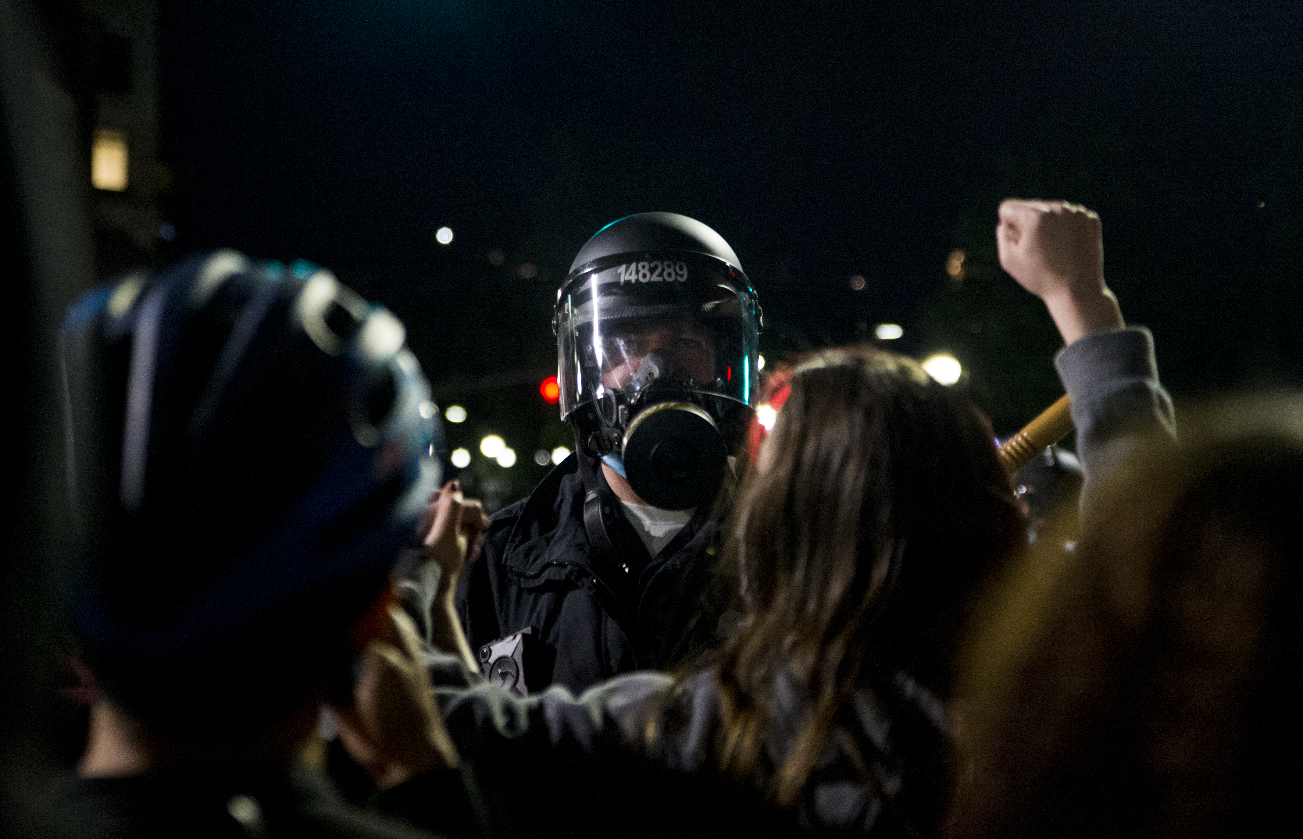 Protestors linked arms in front of the police line on Tremont Street.