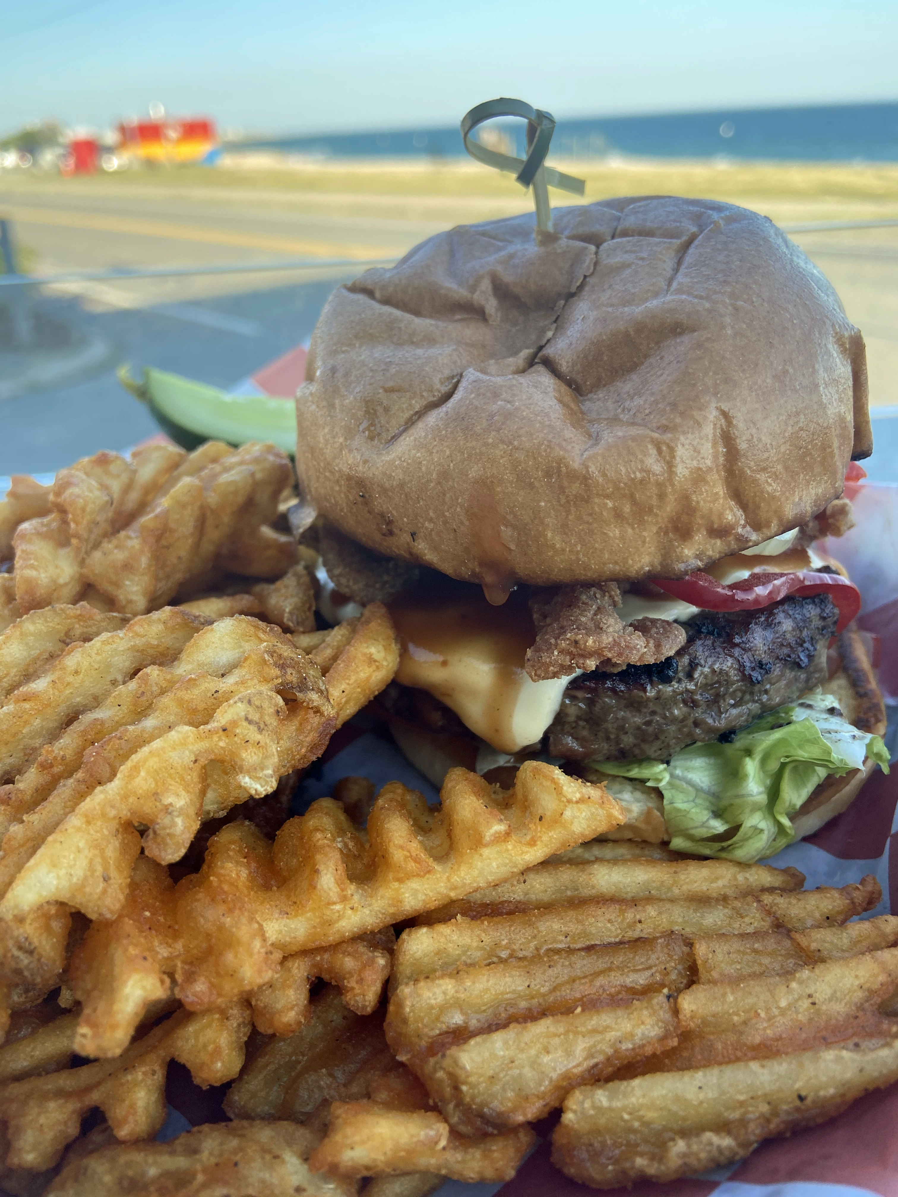 You’ll get an excellent juicy burger at Shipwrecked in Falmouth, and it will taste better with a view of the beach.