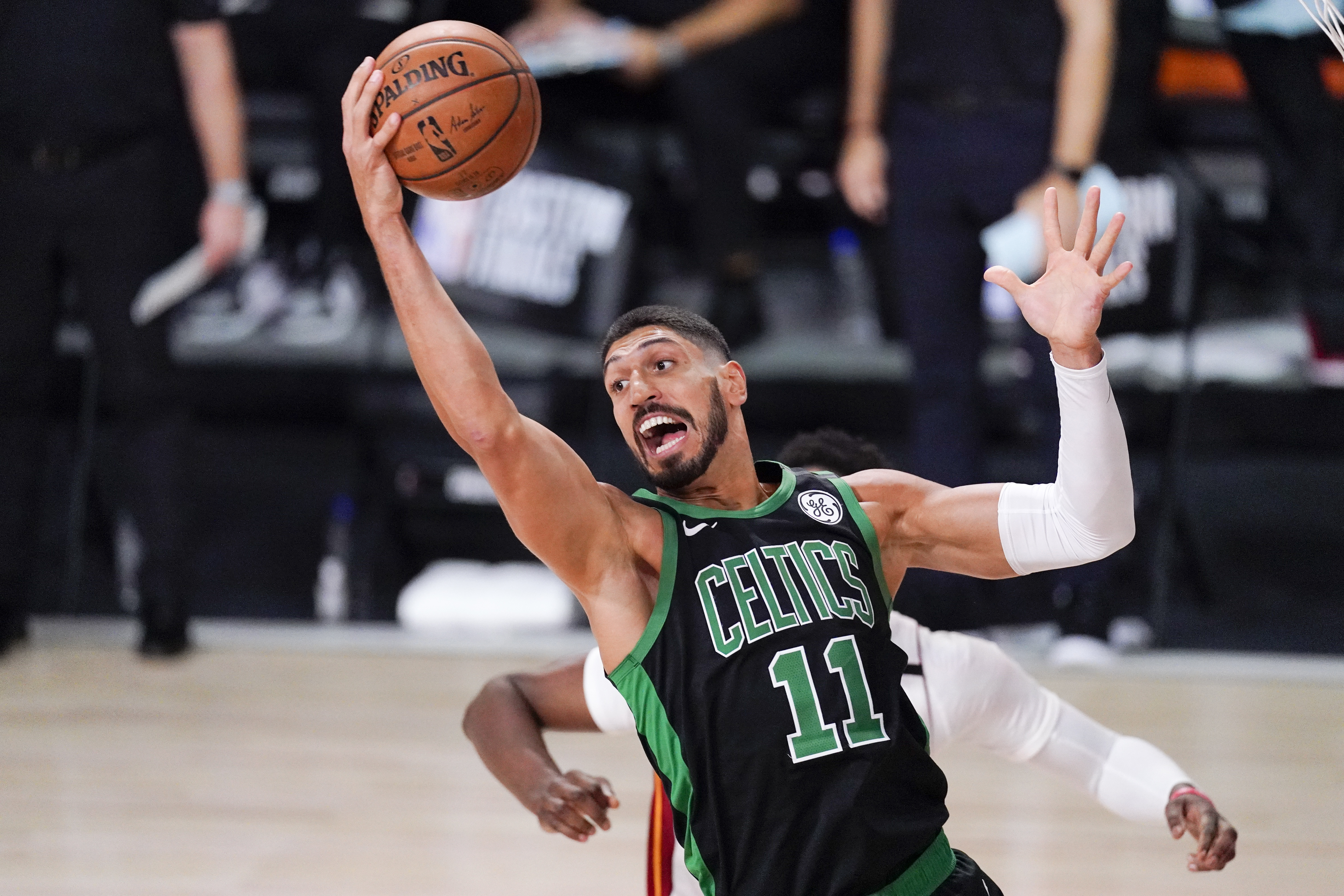 Enes Kanter grabs a rebound in the first half of a playoff game against Miami.