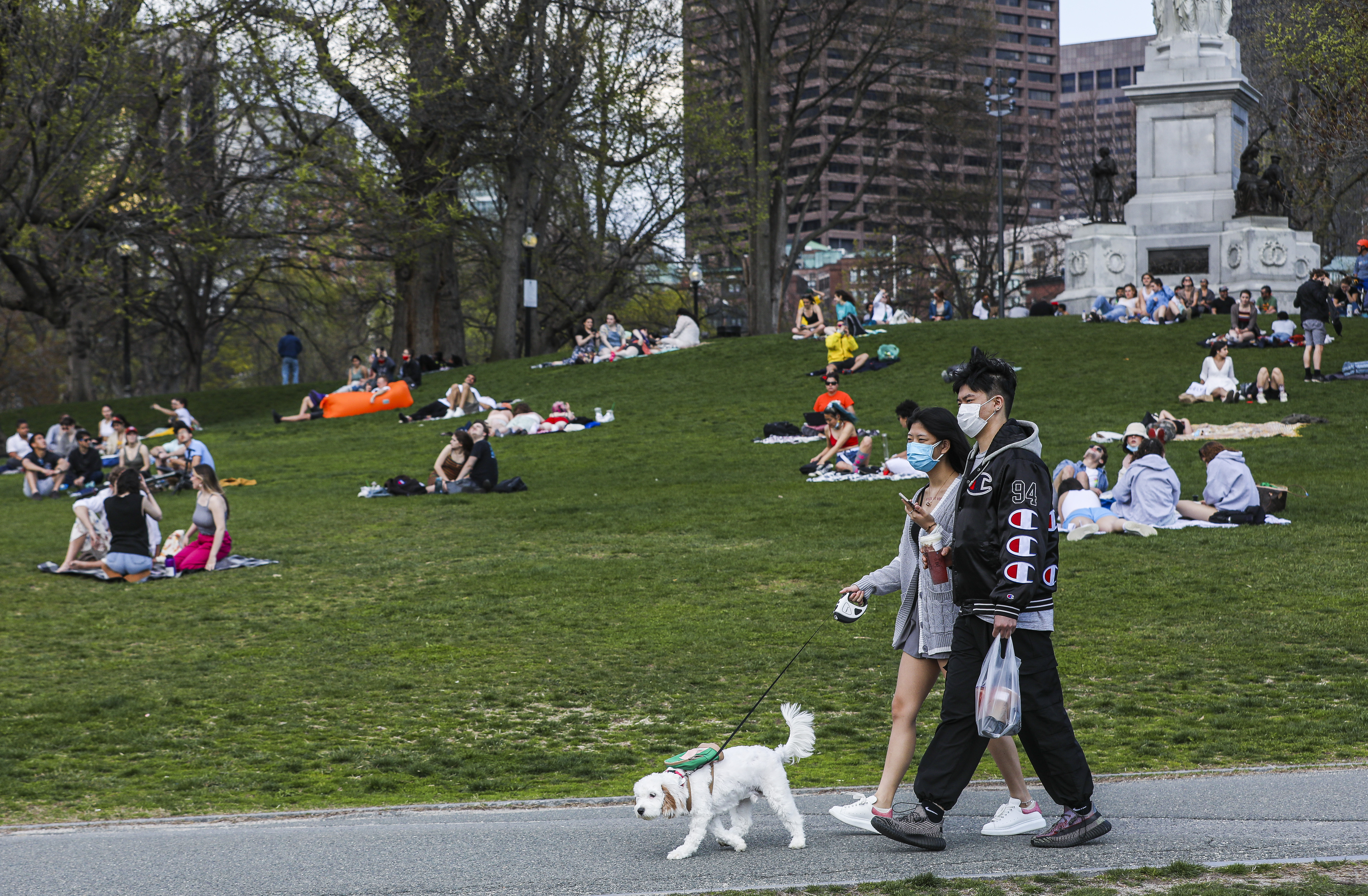 People soaked up the sun in Boston Common as temperatures soared into the 70s on April 20, 2021.