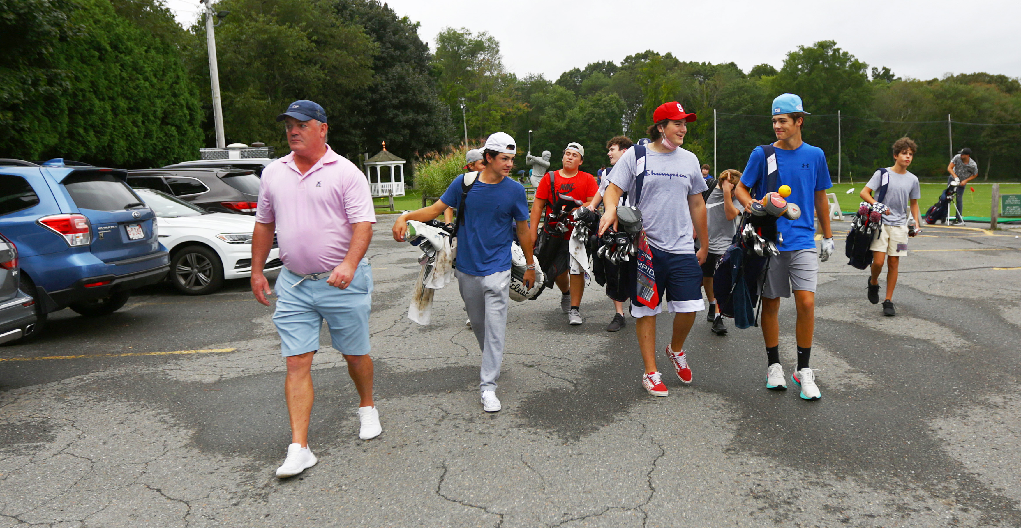 Coach Brian O'Donovan leads his Somerville golf off the practice range at Stone Meadow GC in Lexington.