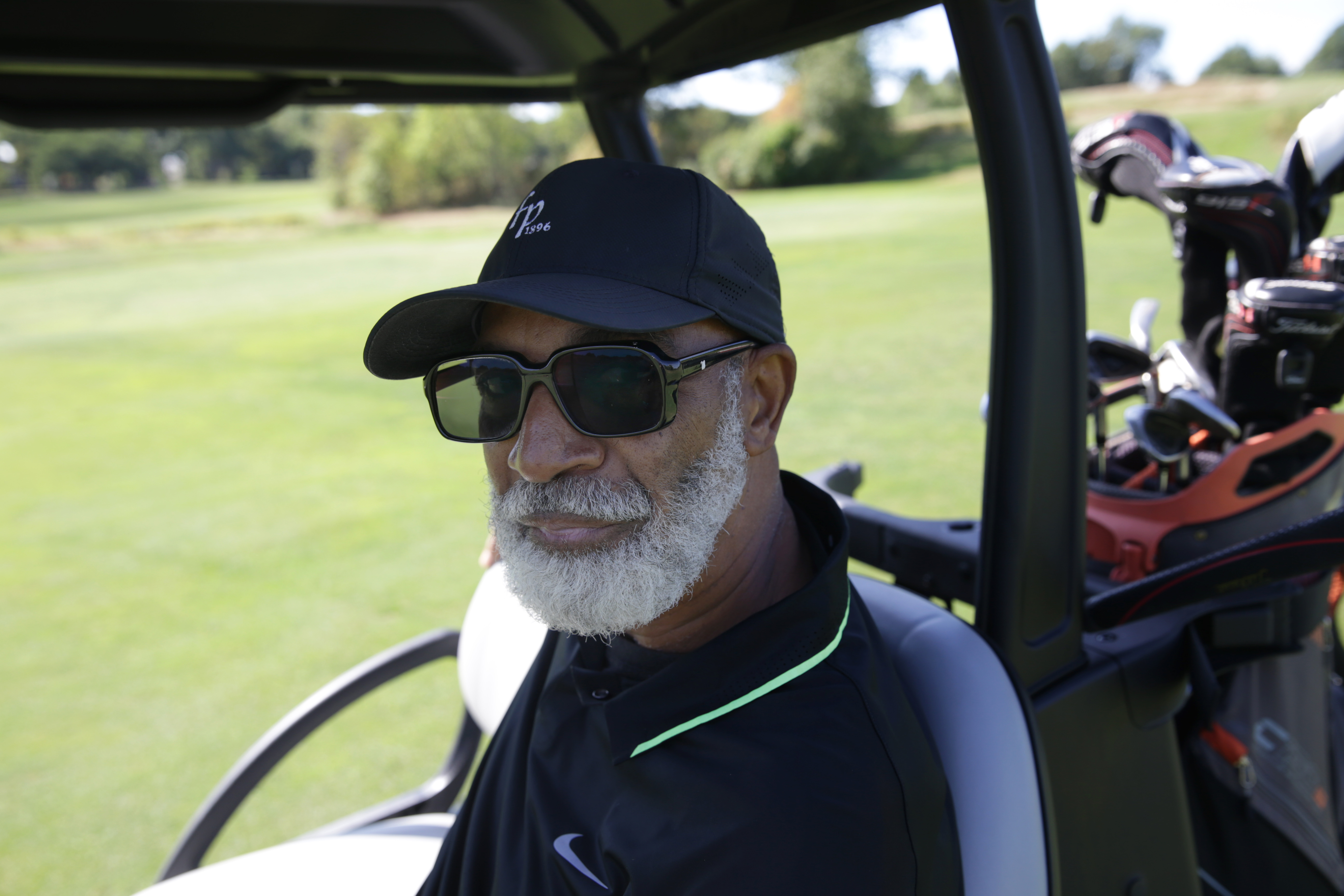 Marshall Thompson, a long-time player at the course, sat in his cart during a round of golf.