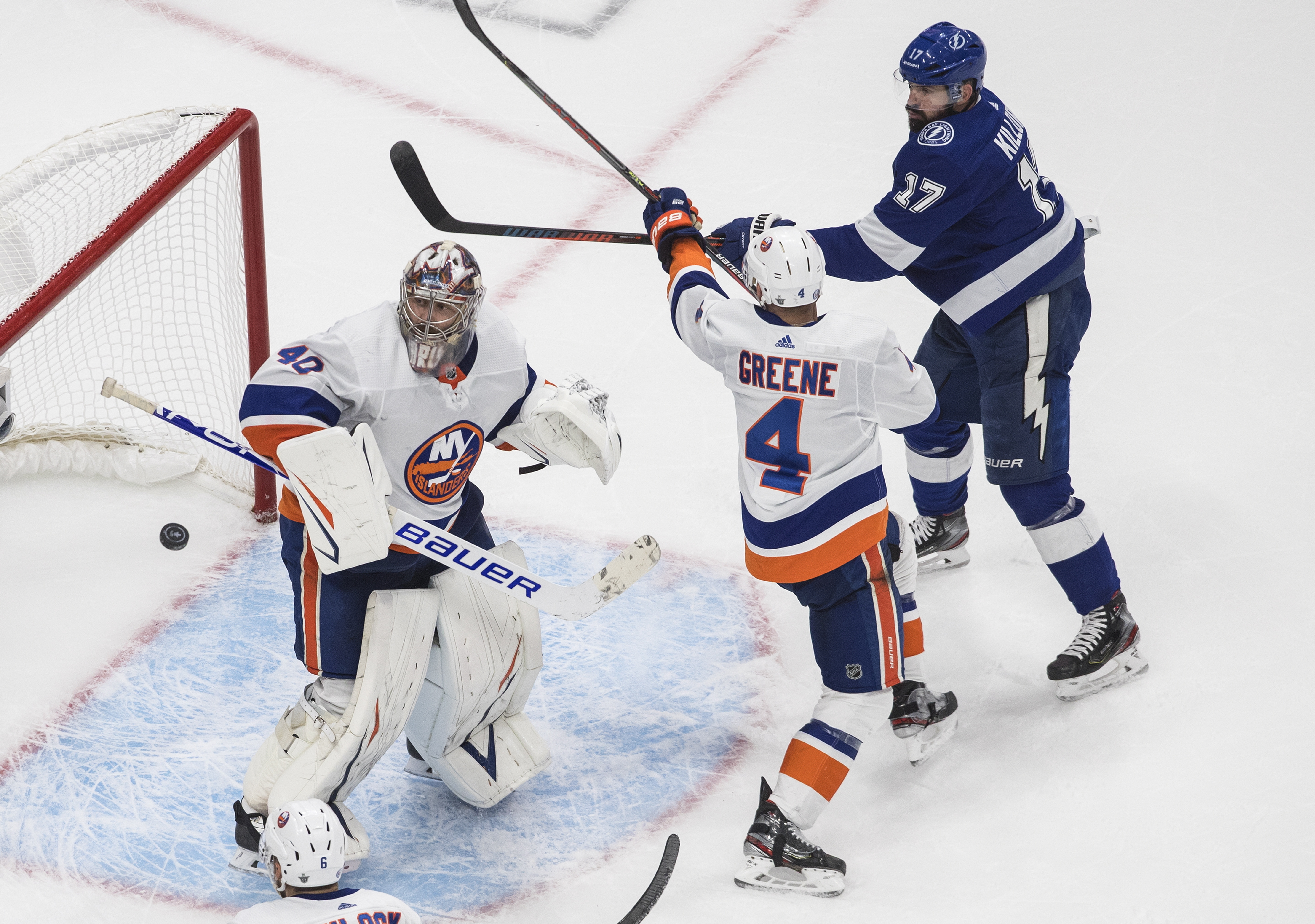 Tampa Bay's Alex Killorn is stopped by New York goalie Semyon Varlamov as Islanders' Andy Greene defends during the third period of Monday's game.