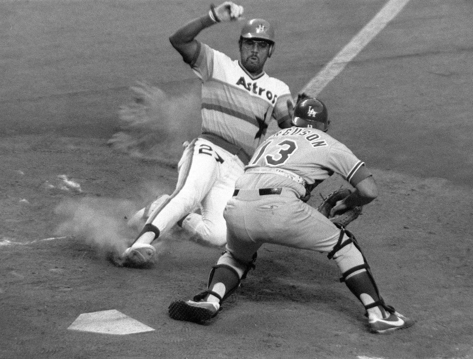 Bob Watson slides home against catcher Joe Ferguson in a 1978 Astros-Dodgers game.