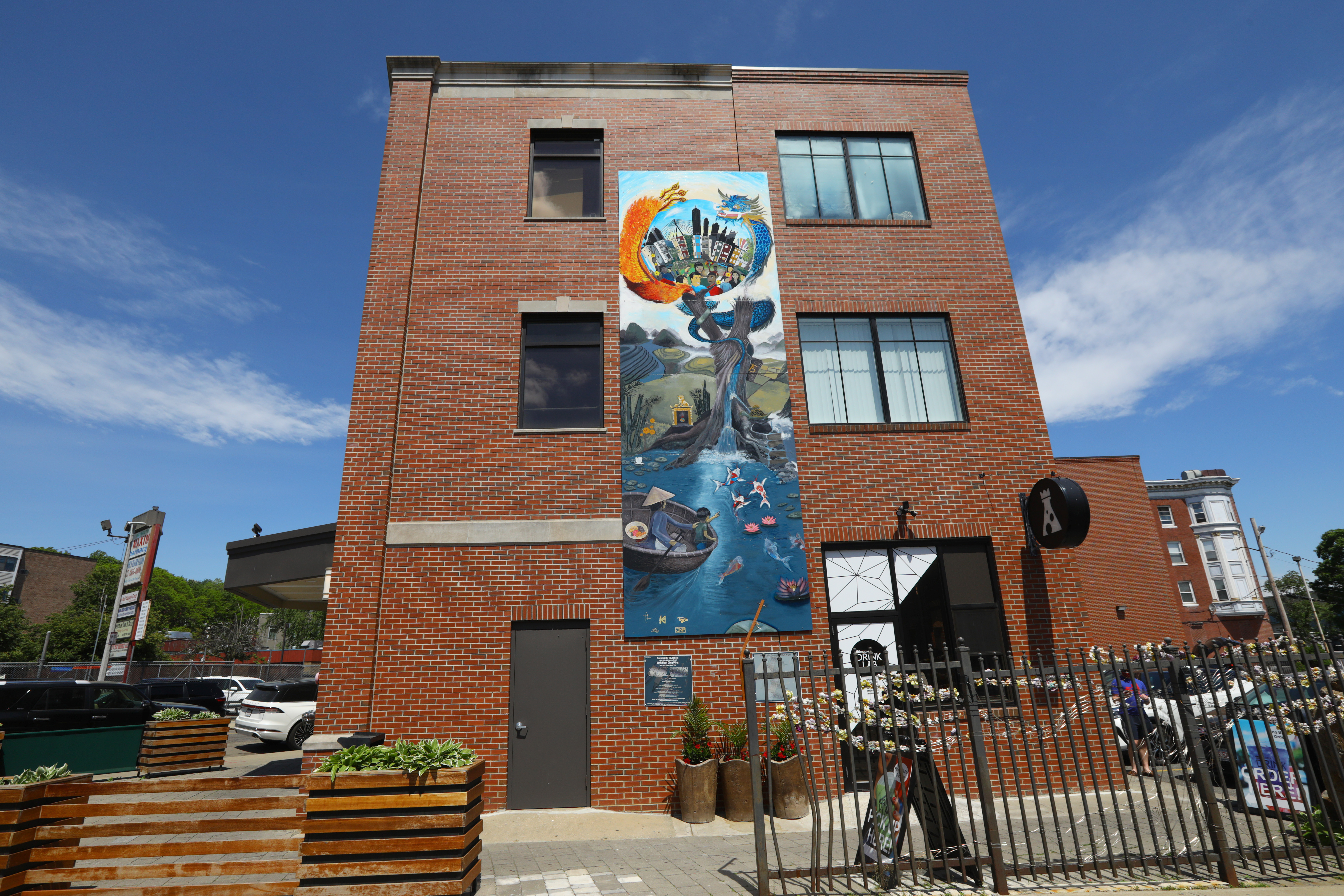 Mural on the side of Pho Hoa Restaurant and Reign Drink Lab.