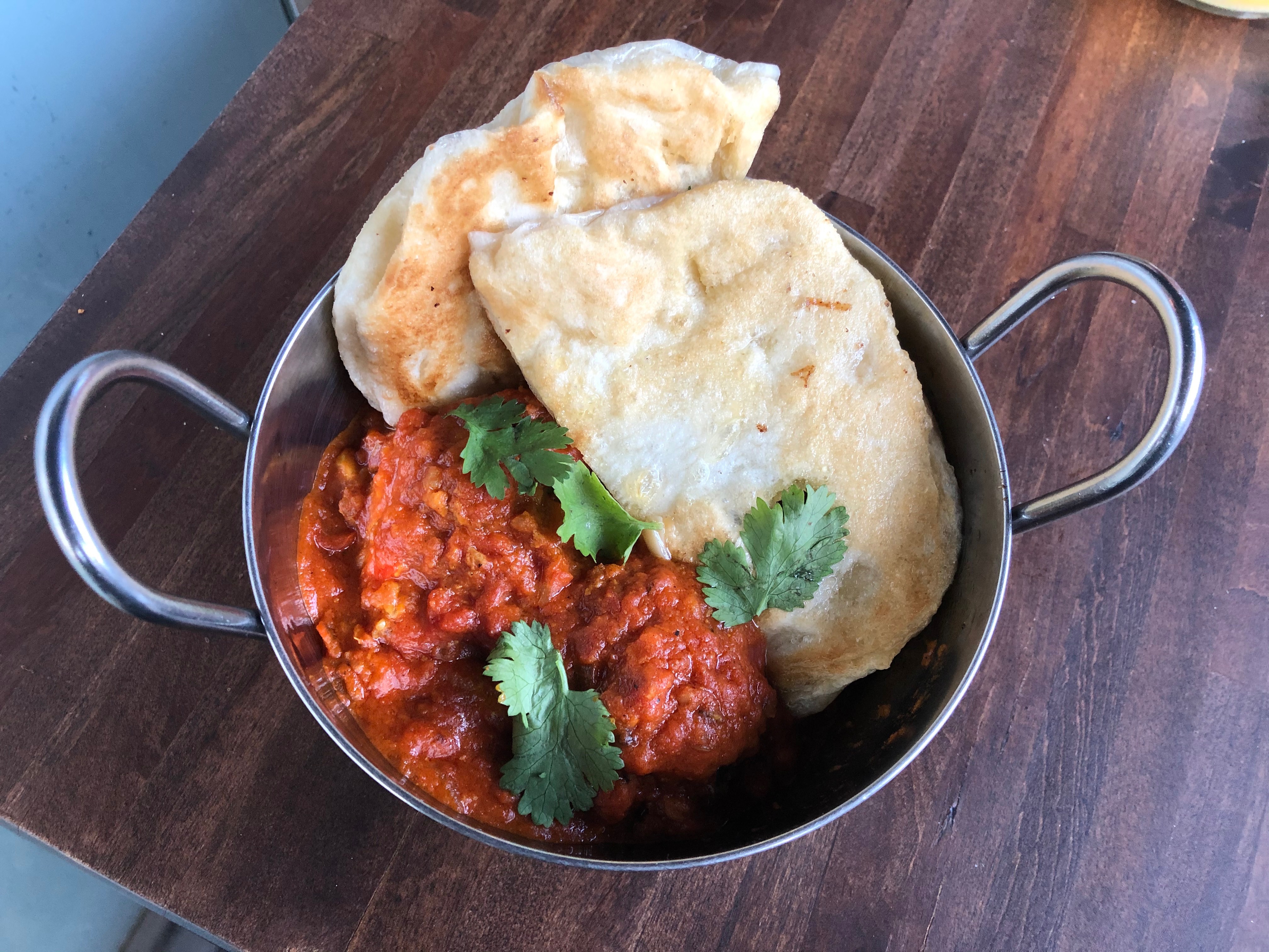 Lamb meatballs with tomato and ginger curry.