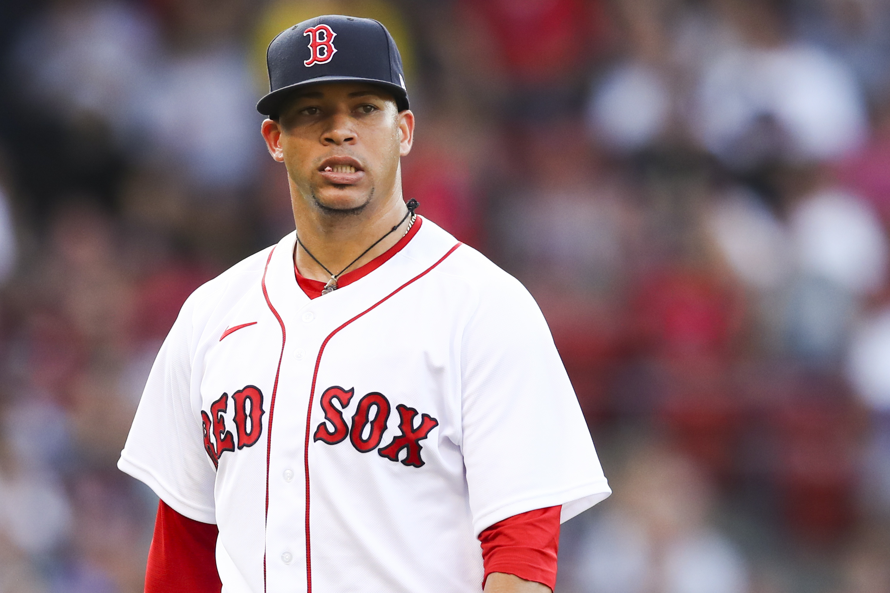 Hansel Robles returns to the dugout in the middle of the sixth inning of Thursday's game after balking home a run against Tampa Bay.
