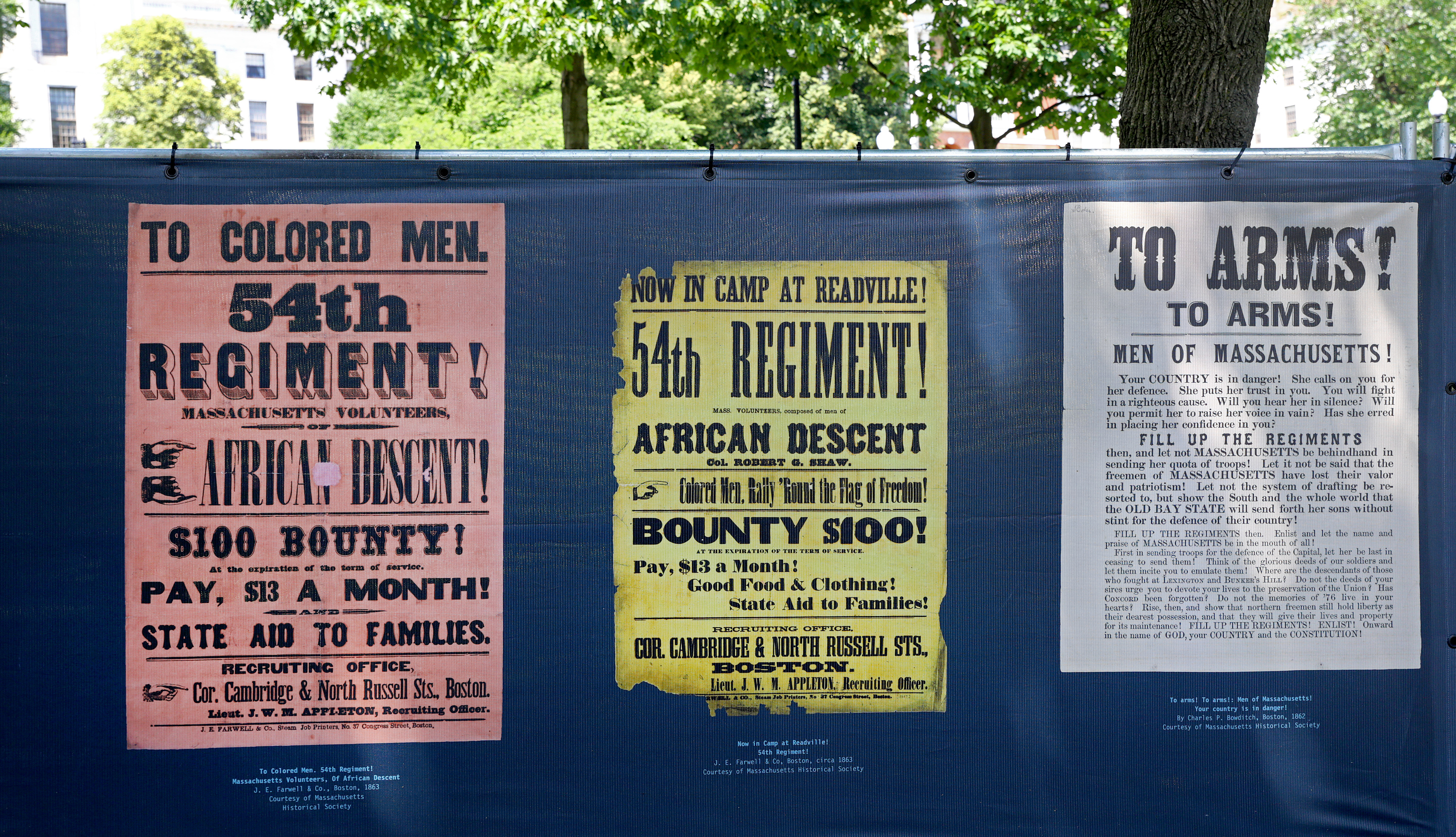 Recruiting posters covered the fencing around the restoration work on the Robert Gould Shaw & The 54th Regiment Memorial.