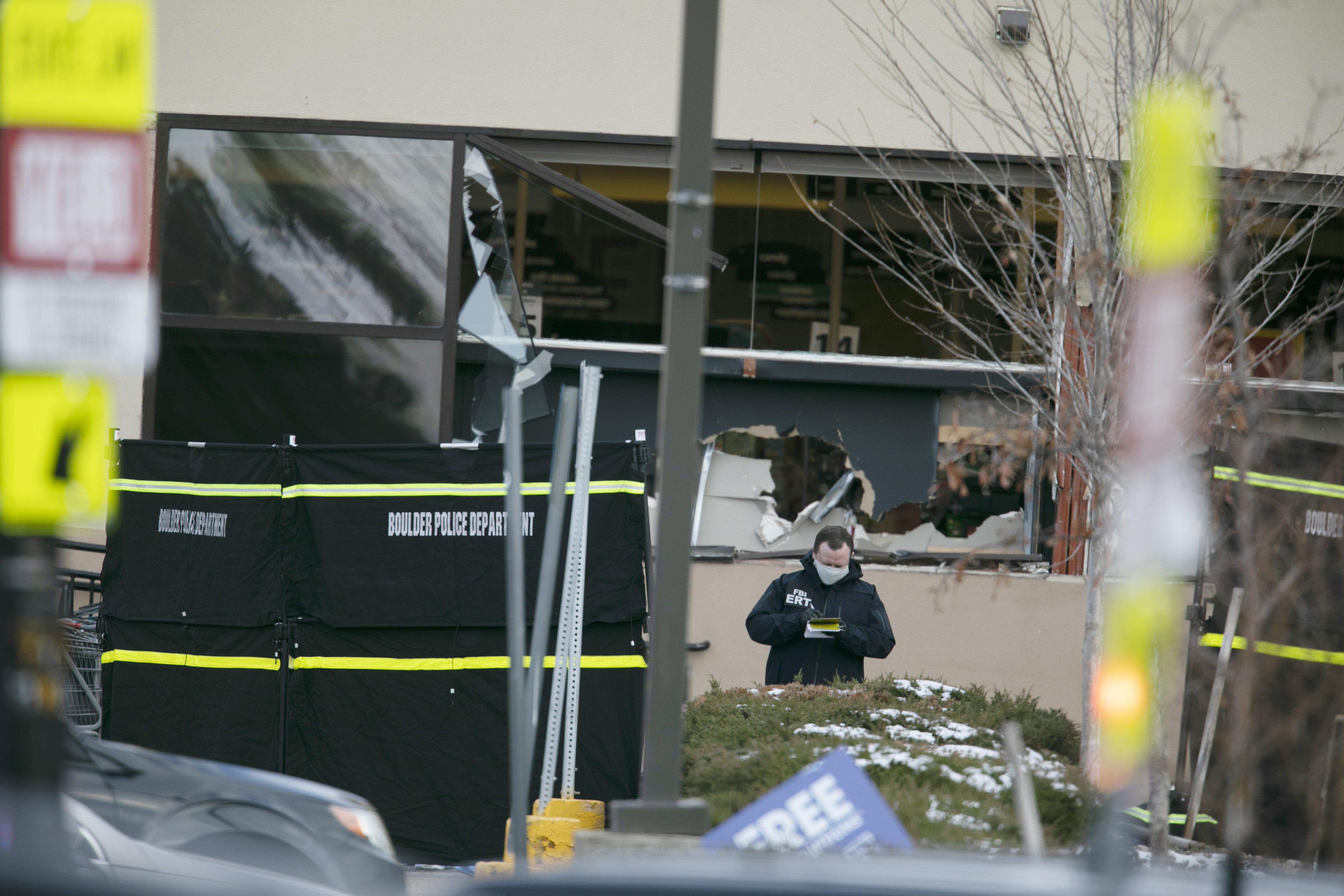 Police worked on the scene outside of a King Soopers grocery store.