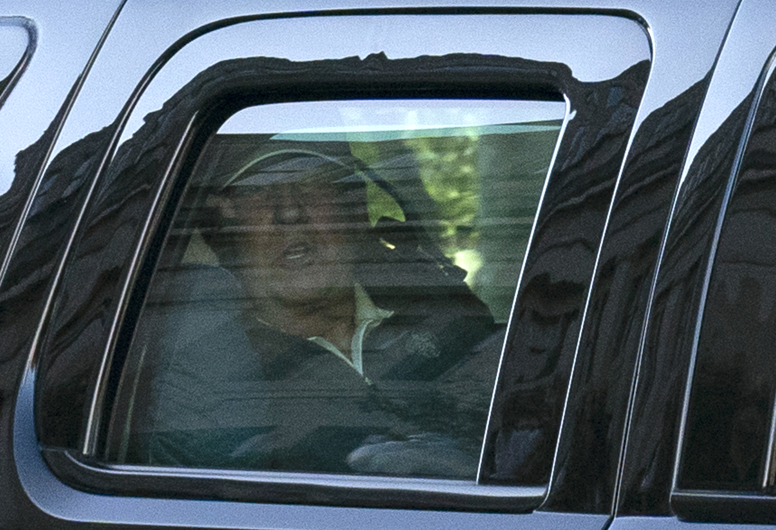 President Trump watches from the motorcade as he returns to the White House after playing golf on Nov. 7. (Alex Edelman/ AFP via Getty Images)