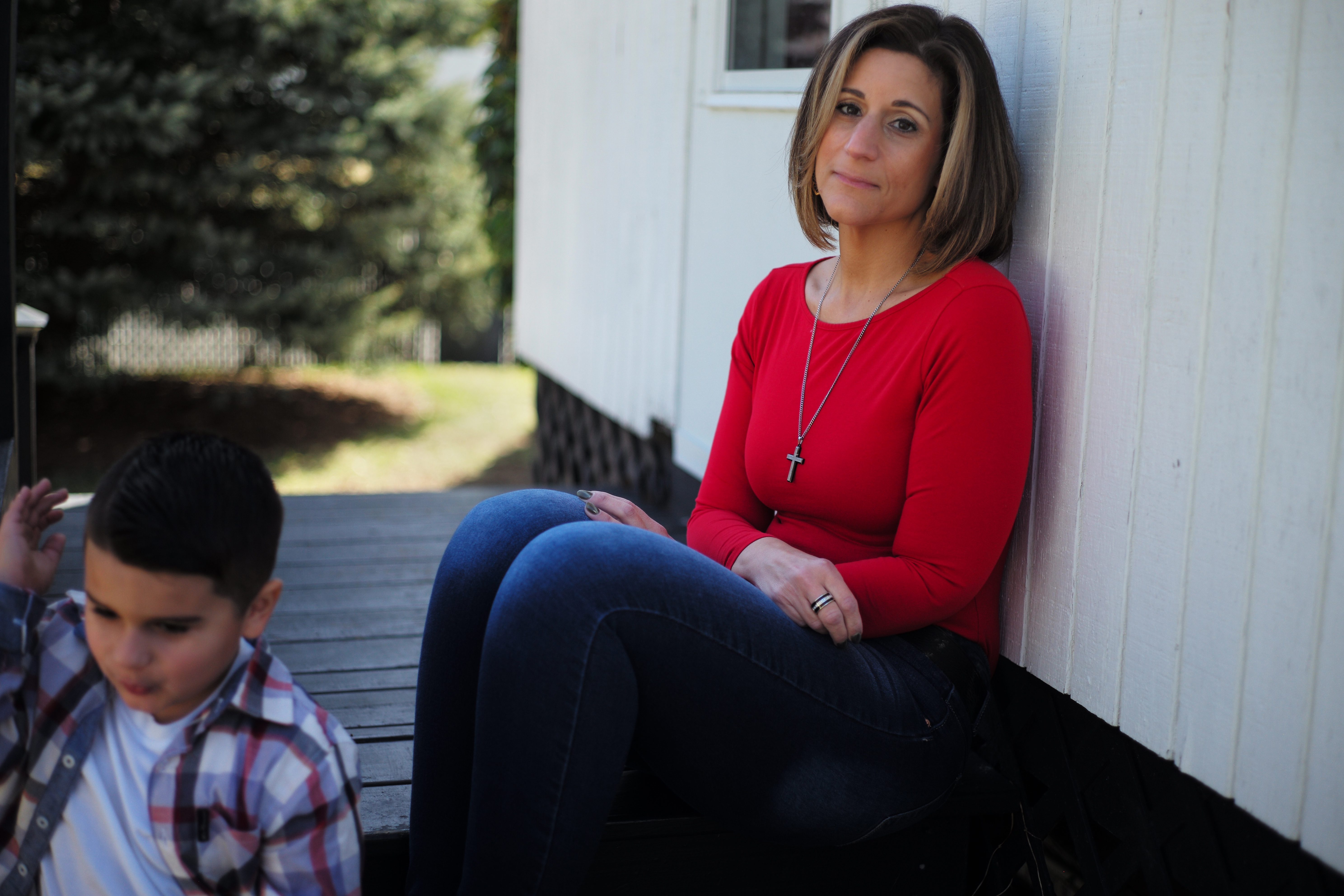 Connie Bitto Medeiros of Brockton, Mass., lost both her husband, Kayne, and her father, Vincenzo, to COVID-19 recently. Her 4-year-old son, Santino, plays nearby.