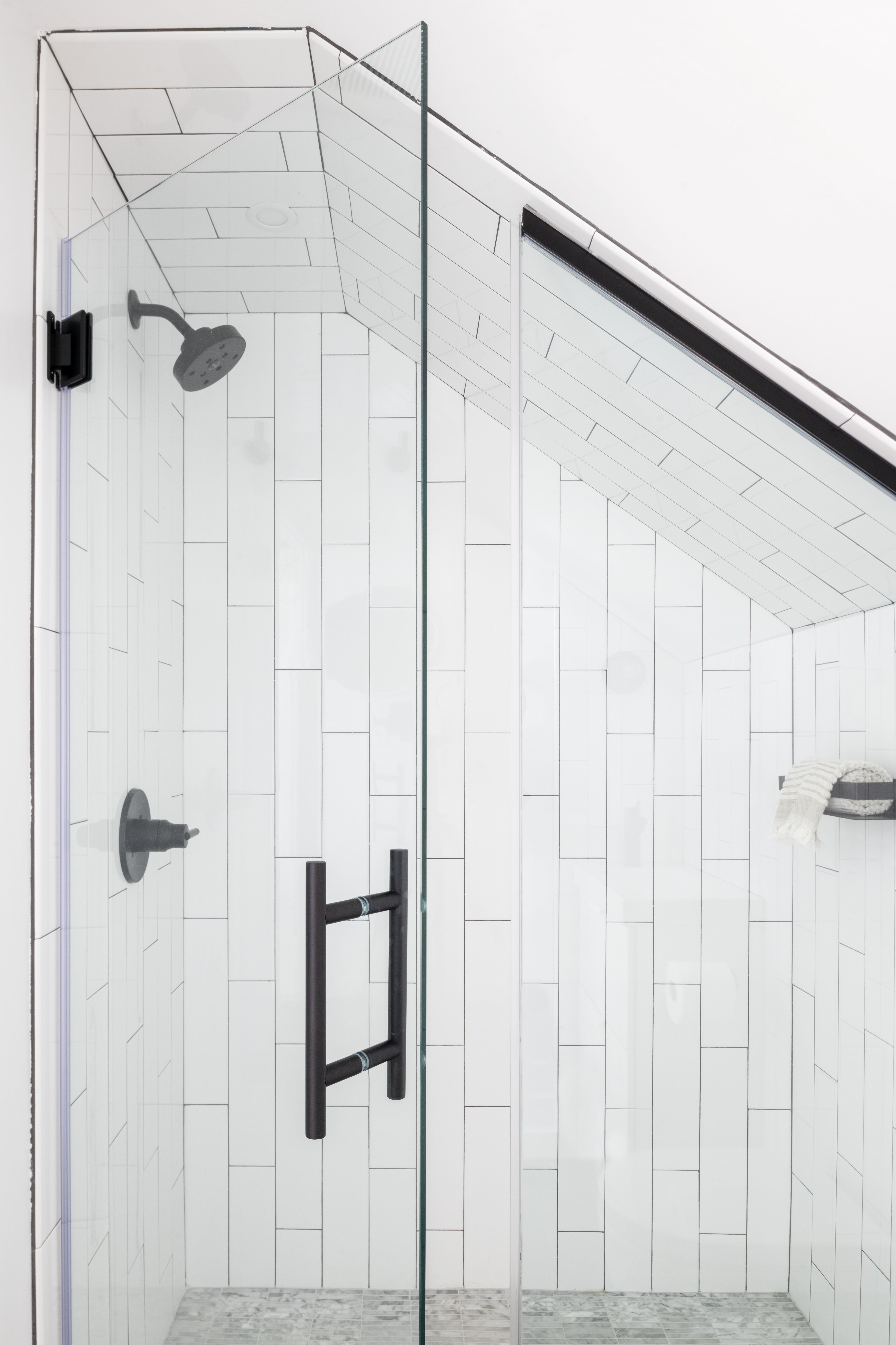 The team was able to fit a shower under the eaves on the fourth floor.
