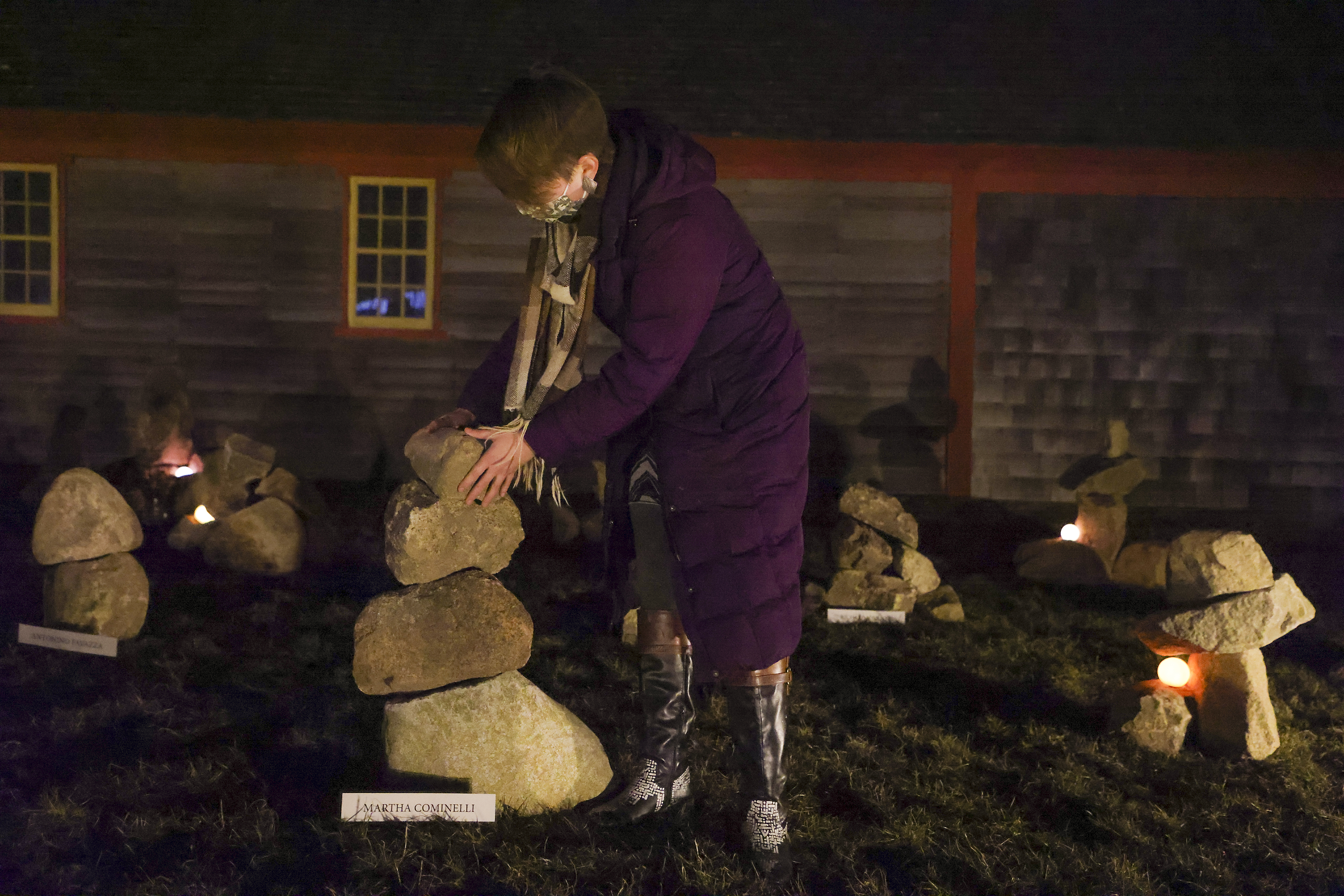 Cape Ann Museum education manager Miranda Aisling made some adjustments to the cairn memorials over the weekend.