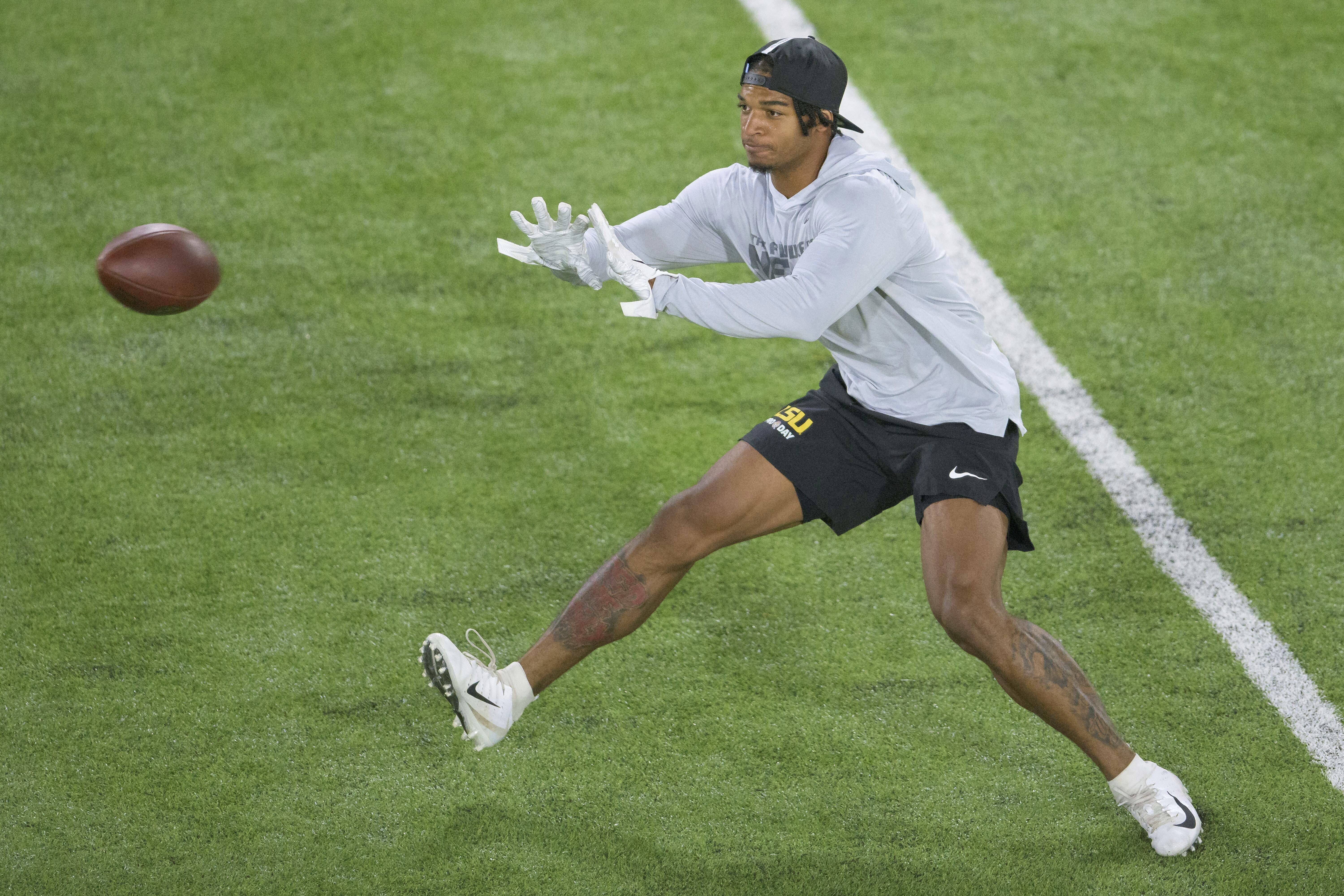 LSU wide receiver Ja'Marr Chase, who opted out of the season, works out at a pro day in March.
