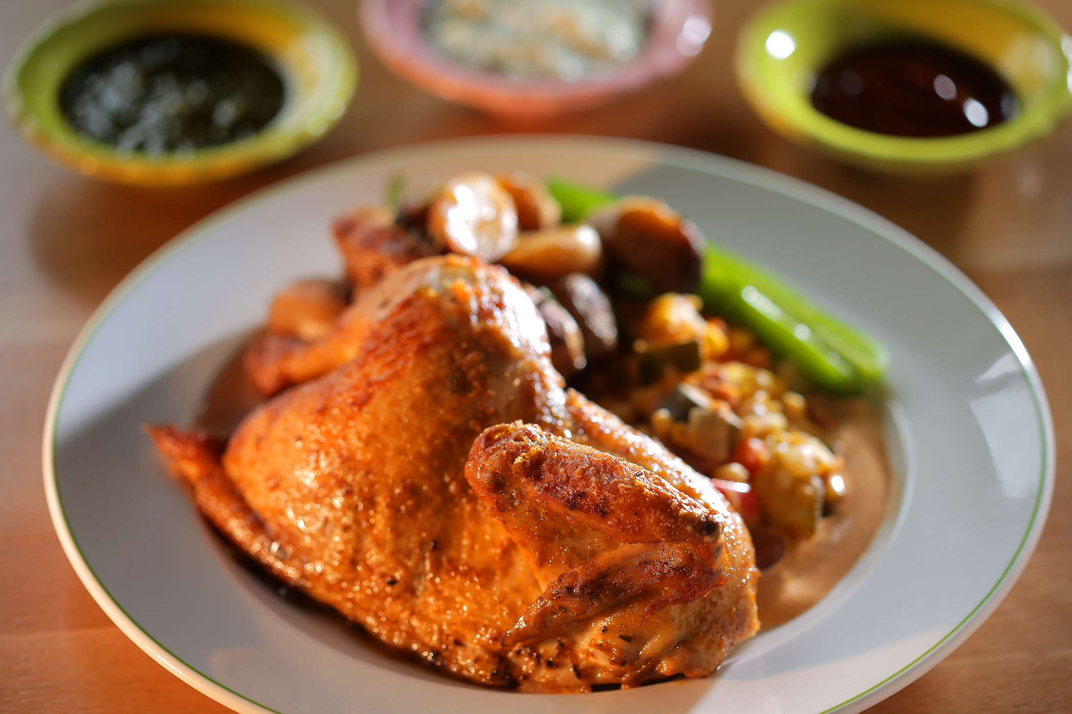Half wood-fired rotisserie chicken at Mr. Roni Cups.
