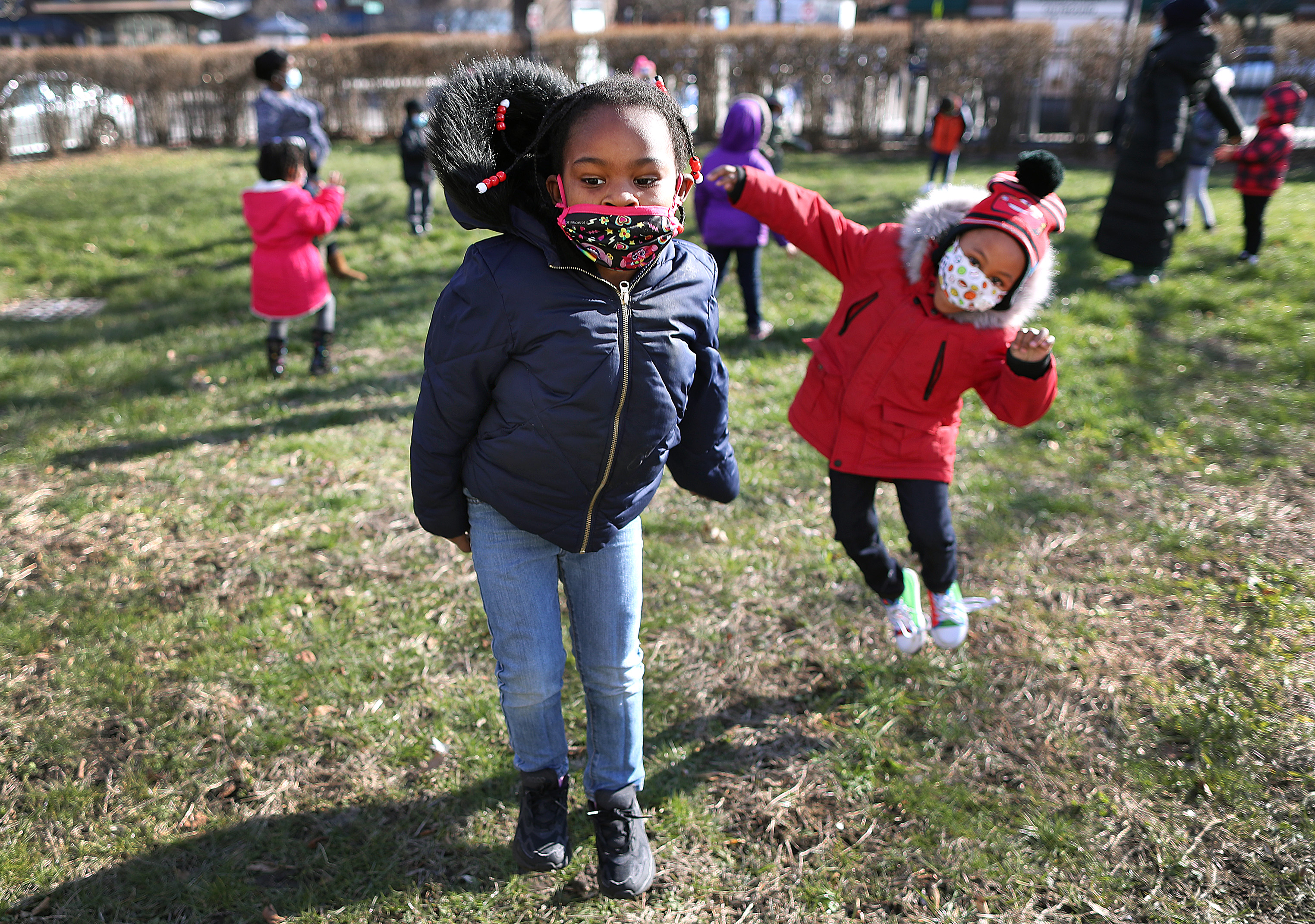 Skyla Withers, 5, left, and Giovanni Gamble, 5, played with other children at the Cooper Community Center in Roxbury.