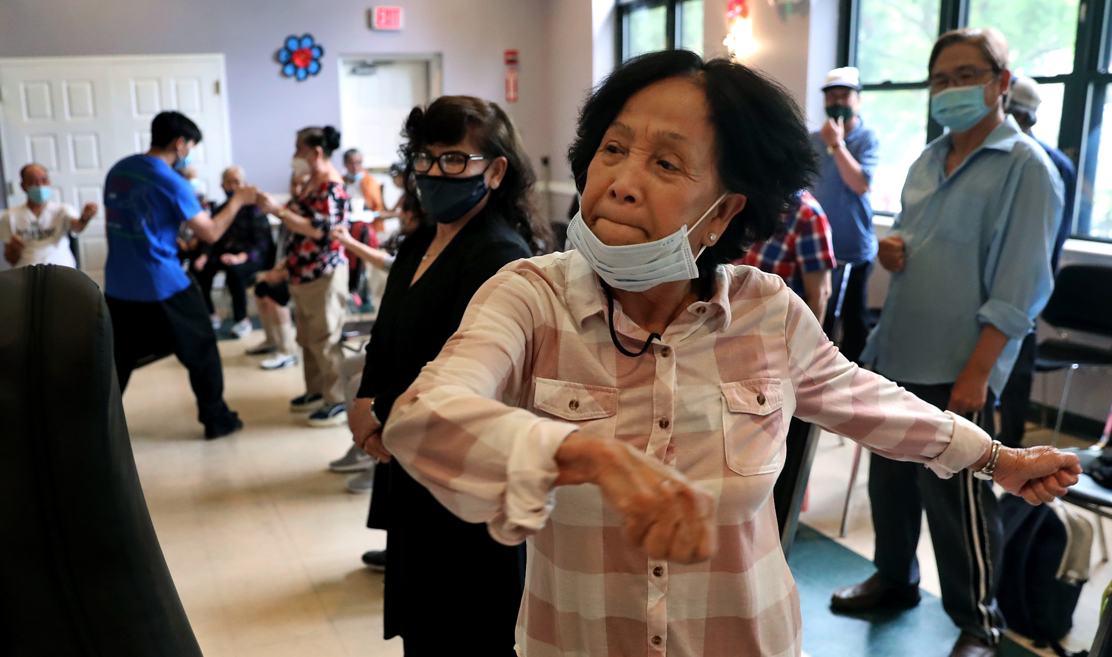 Ton Do, 75, practiced throwing a punch during a class in self-defense at VietAID’s community center in Fields Corner.