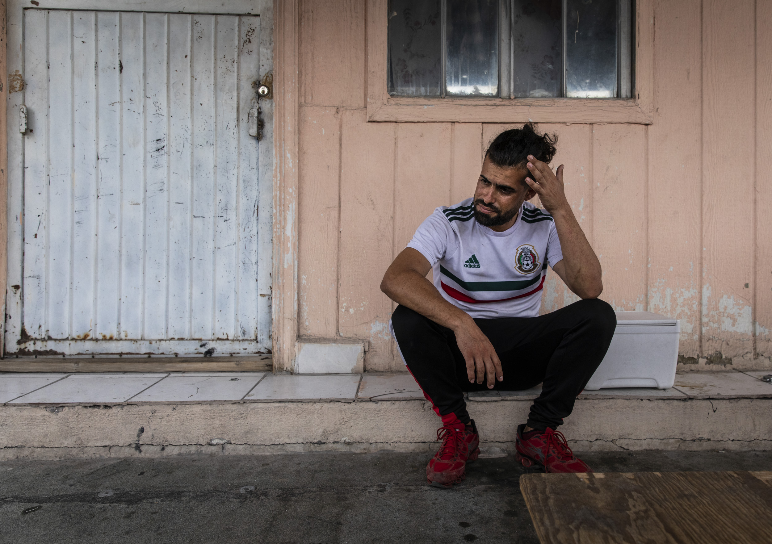 Jose Angel Garcia, 31, rubbed his head while remembering his journey from Cuba to Juarez. He arrived in Juarez over a year ago and has been trying to get to the US to seek asylum status. If immigration regulations remain the same, he will be forced to return to Cuba.