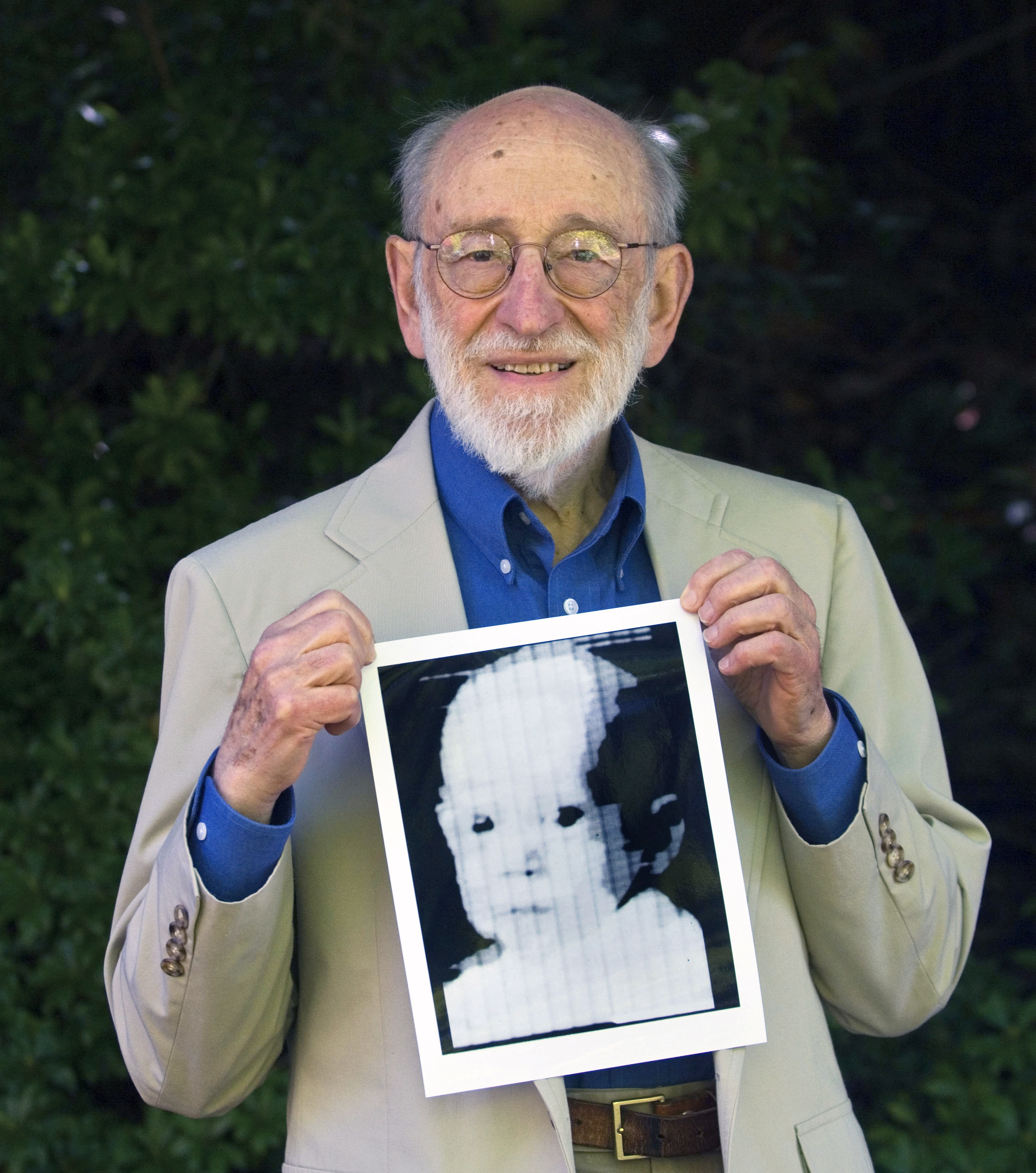 In this 2007 file photo, Russell Kirsch holds the image of his son, Walden, that was scanned into the world's first digital scanner in 1957. Mr. Kirsch, a computer scientist credited with inventing the pixel and scanning the world’s first digital photograph, died Aug. 11 at his home in Portland.