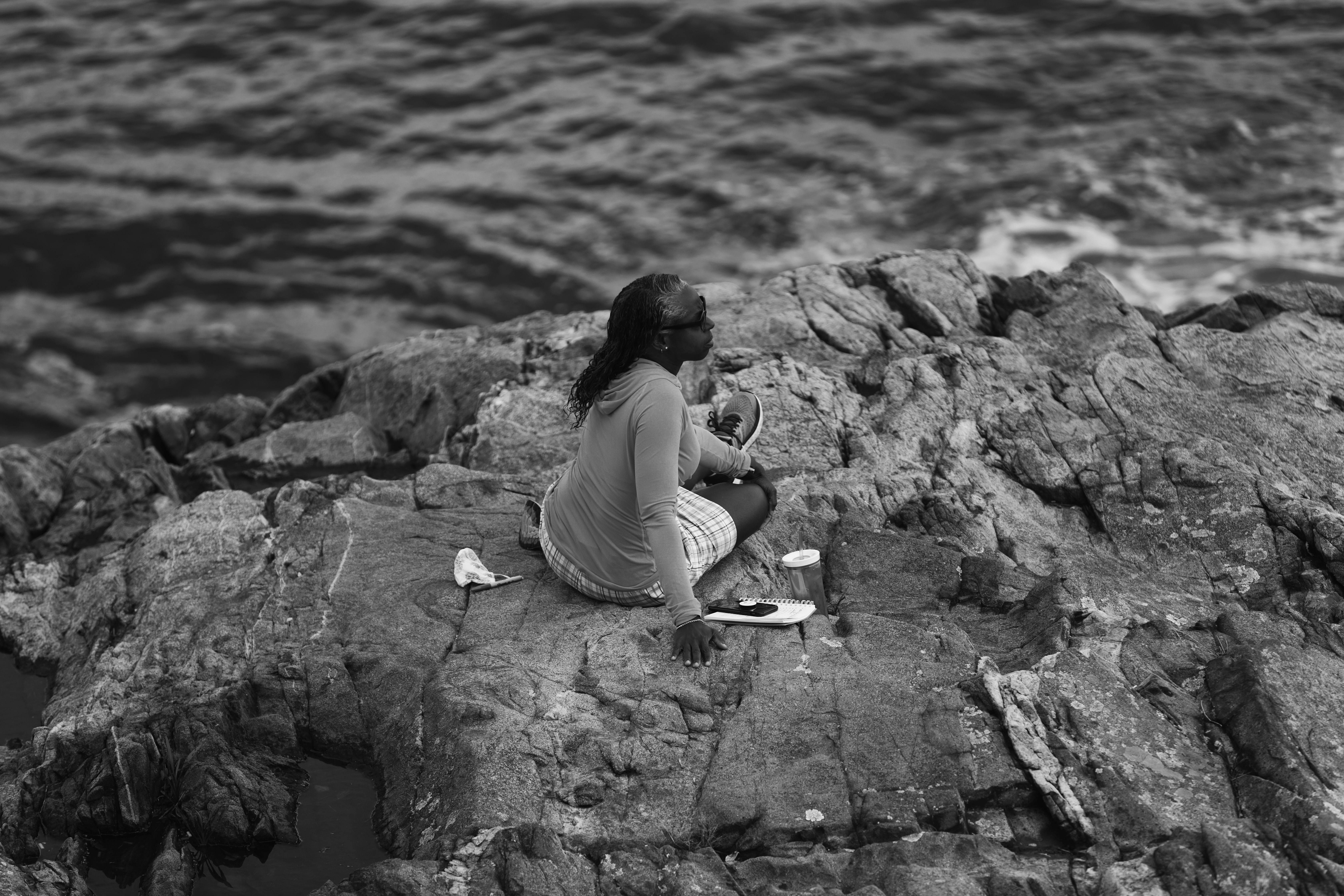 Jodi-Tatiana Charles likes to sit out on a rock off Fort Sewell, overlooking Marblehead Harbor, to get inspiration for her work.