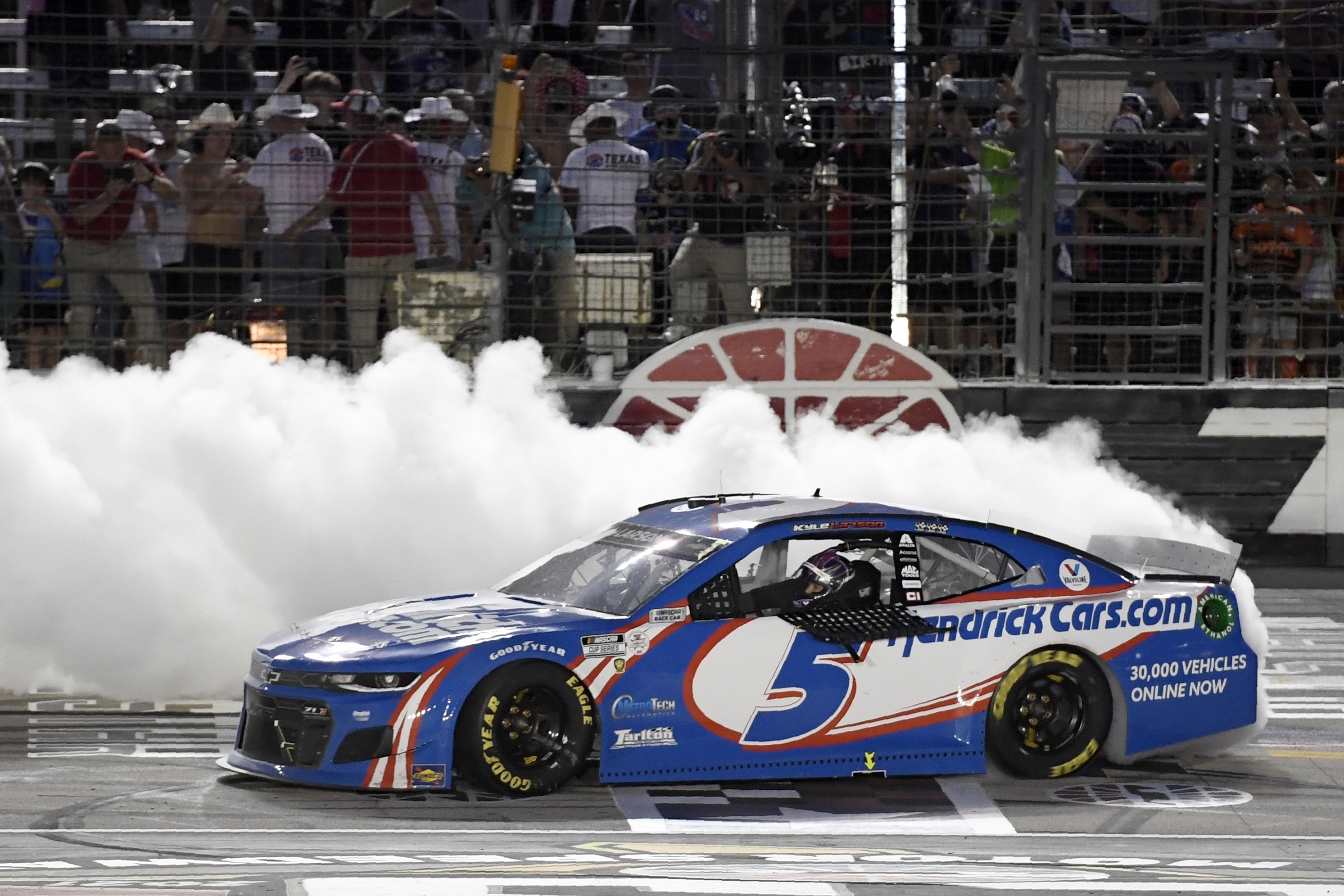 Kyle Larson celebrates in style after winning the NASCAR Cup Series All-Star auto race Sunday night.