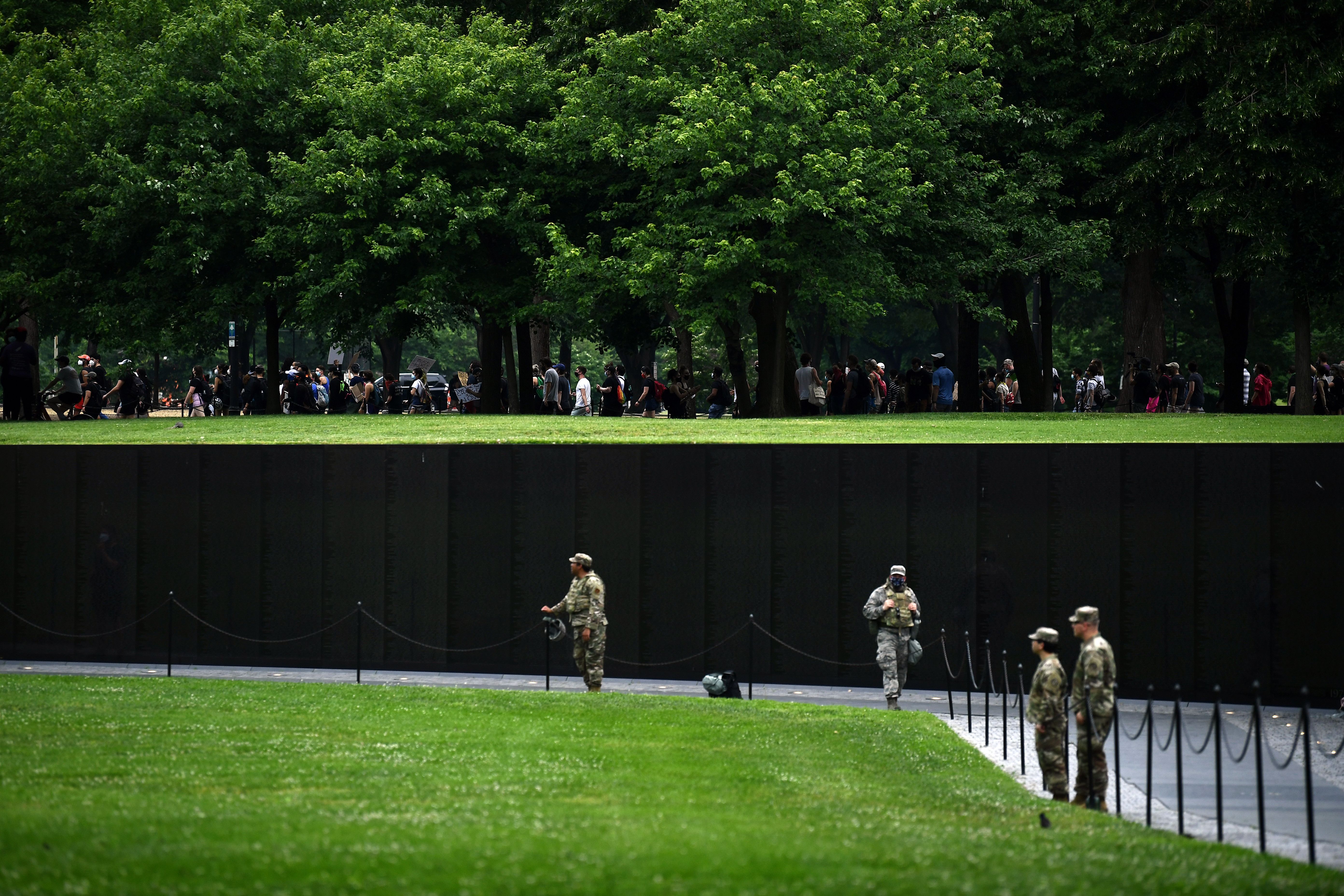 Protestors marched by the Vietnam Veterans Memorial at the National Mall during a demonstration.