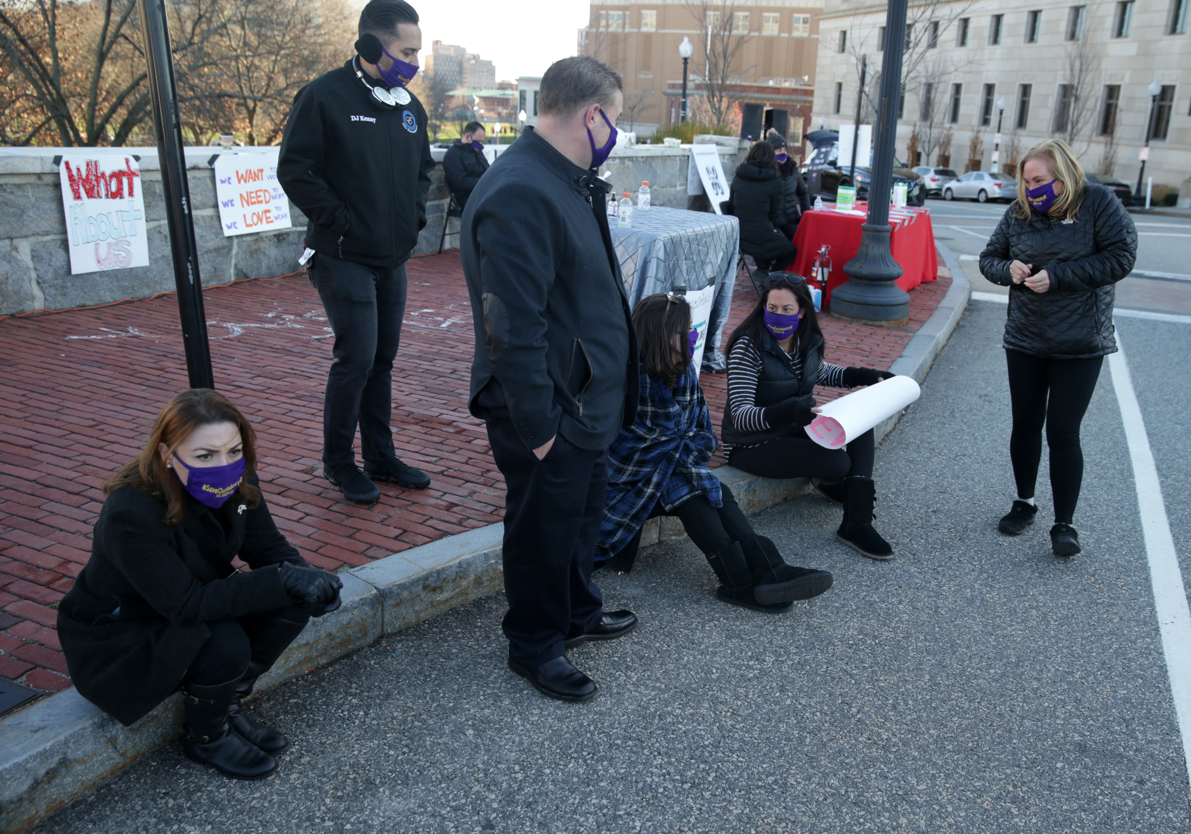 PROVIDENCE -- A handful of people rallied outside outside the Veterans Memorial Auditorium while Governor Gina Raimondo gives her weekly press conference on Thursday. The participants were calling for aid for the wedding and events industry, which has been adversely impacted by Coronavirus restrictions.