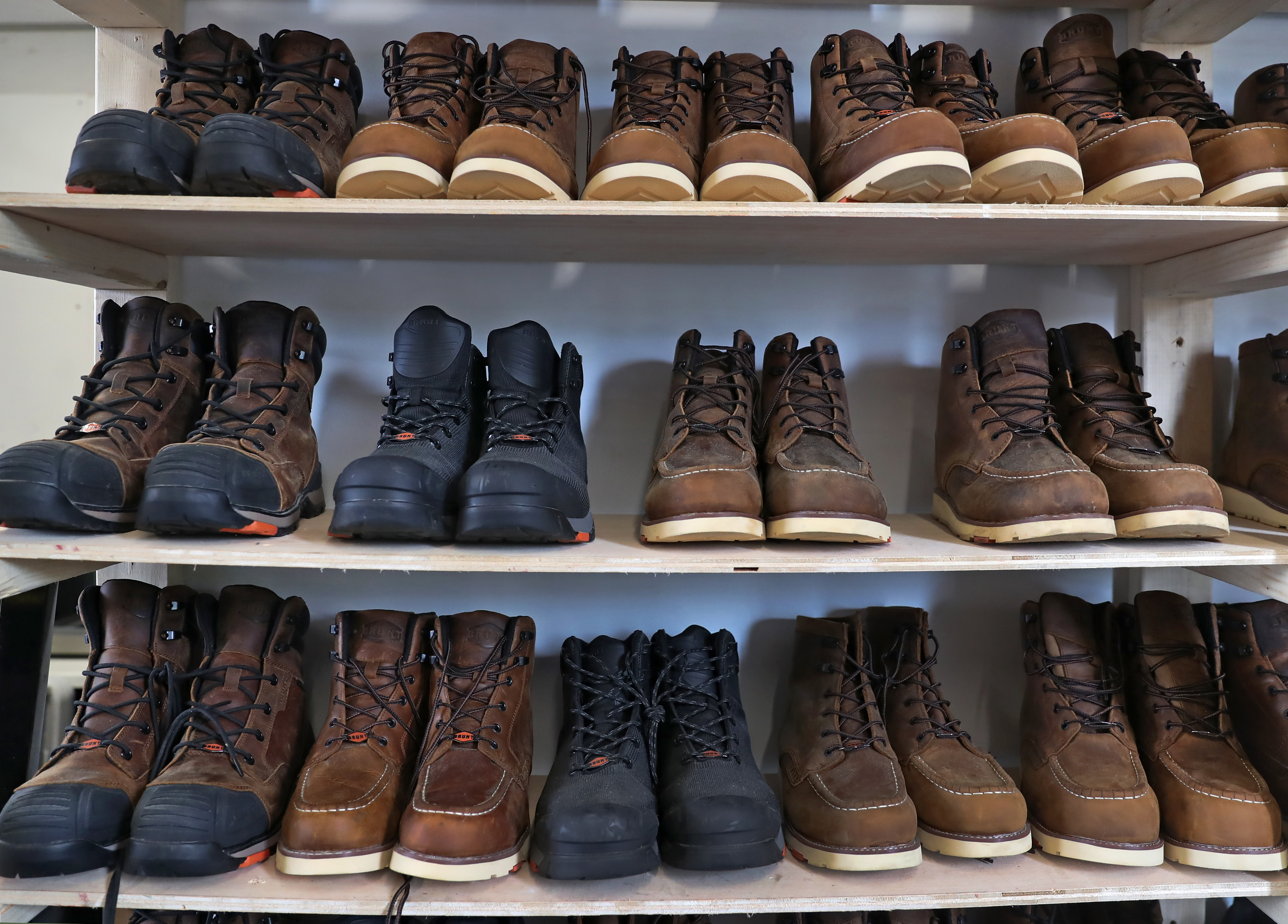 Boots were lined up according to size and style on a rack at Brunt Workwear, a footwear startup that focuses on boots for construction workers and tradespeople. 