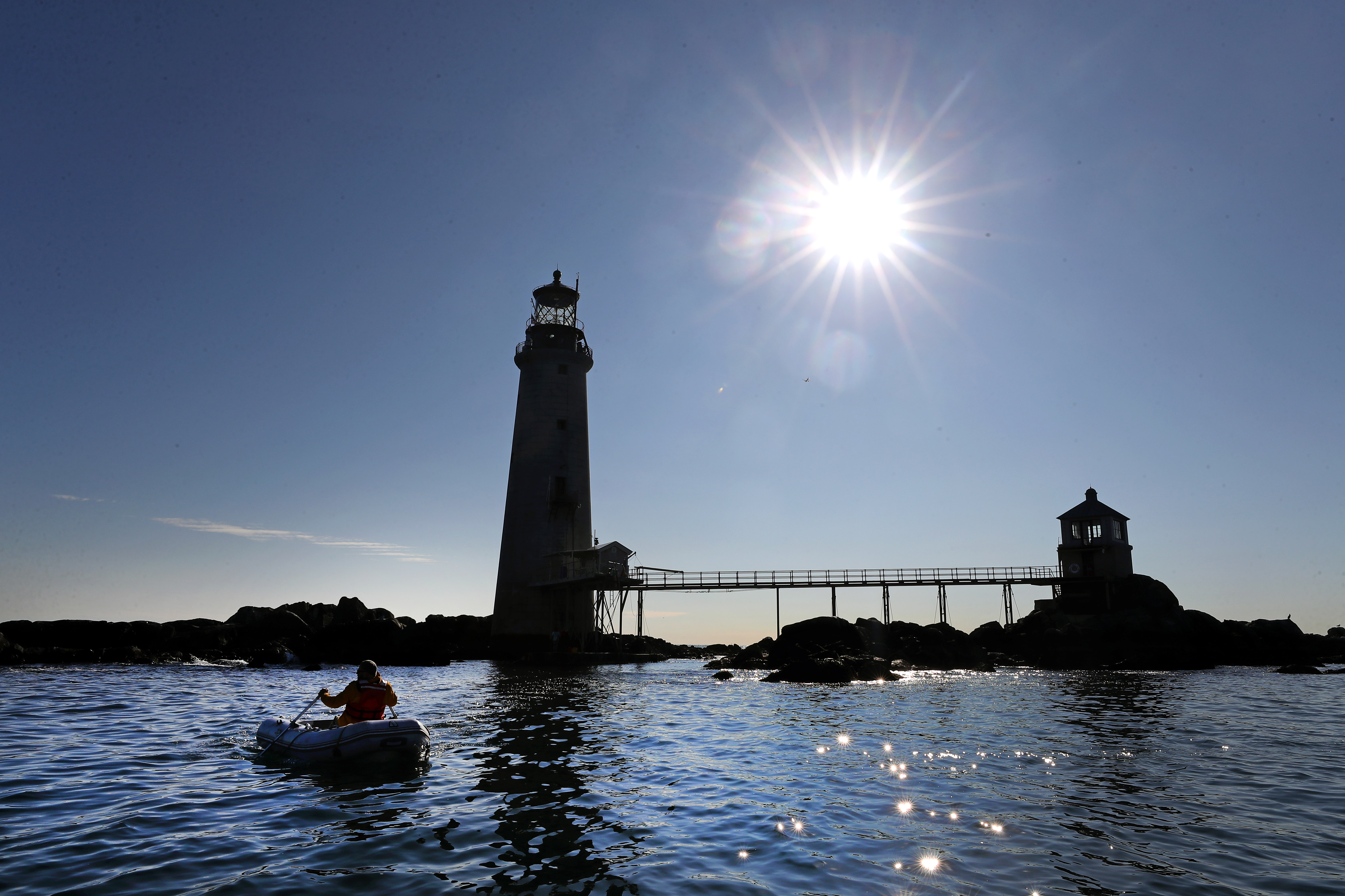 Waller rowed toward Graves Light. It stands on a rocky ledge in Boston Harbor, surrounded by water.