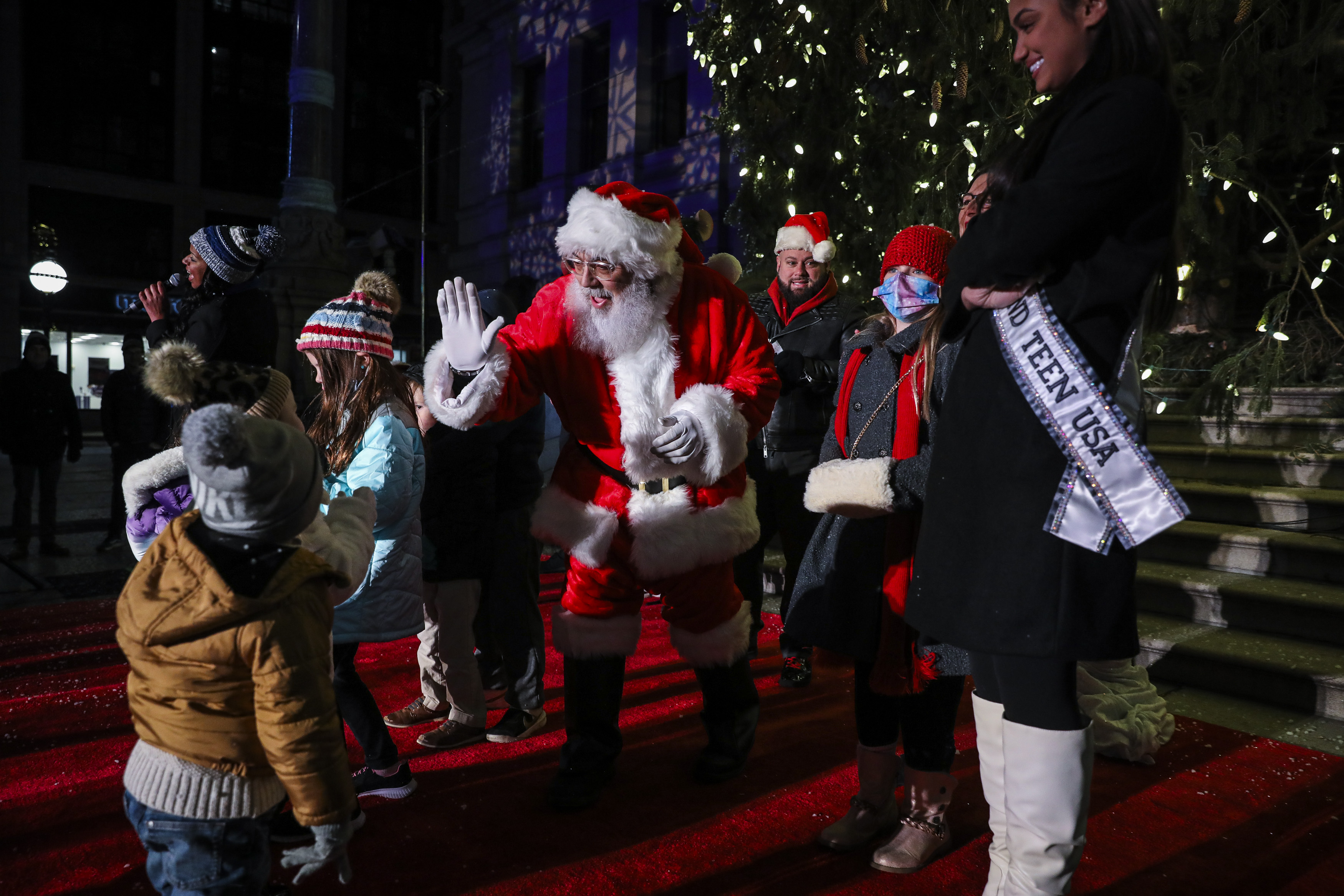 Santa is raising five children while attending the annual tree lighting at Providence Town Hall.