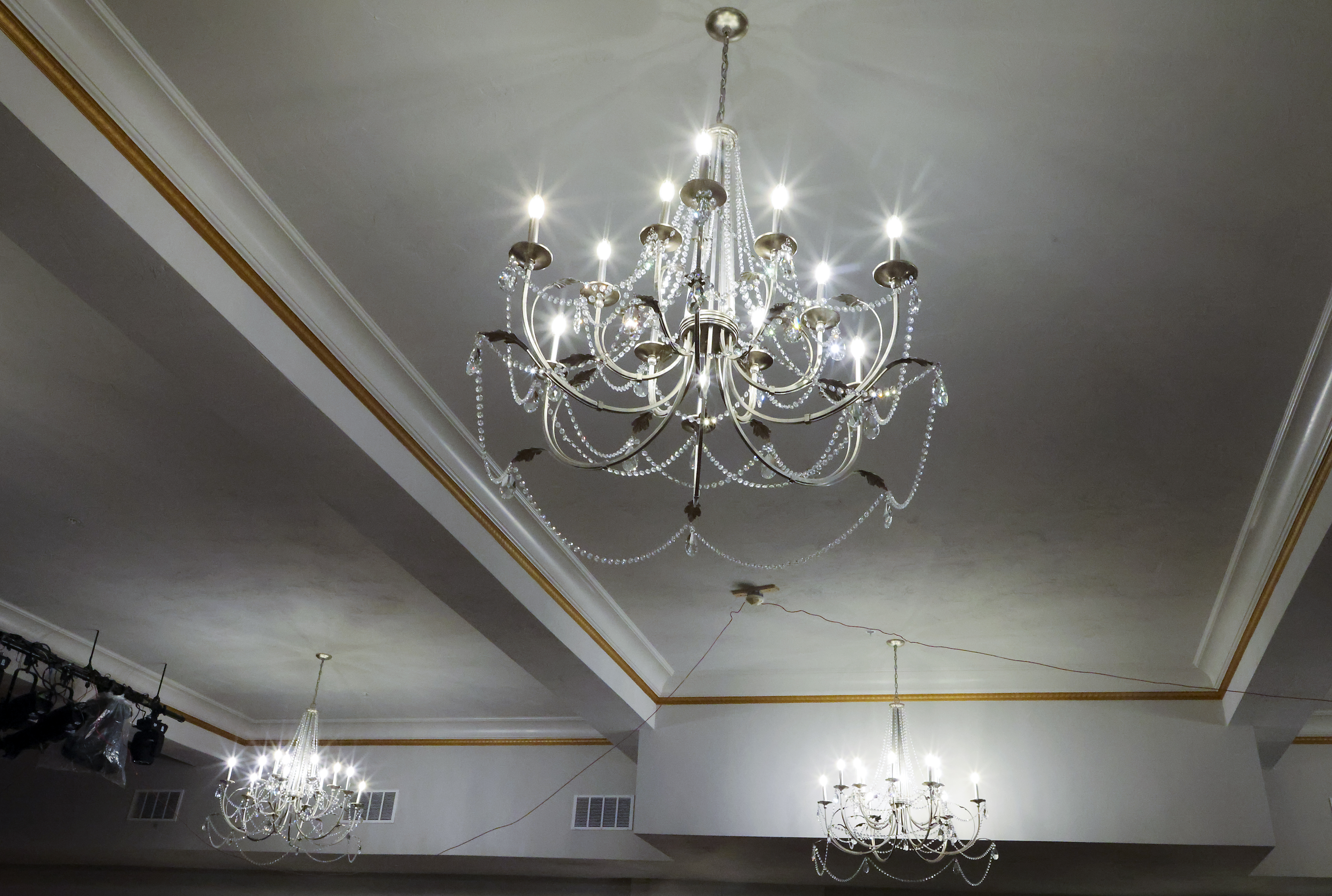 Chandeliers hang in the Crystal Ballroom at Somerville Theatre in a space formerly occupied by two small movie theaters.