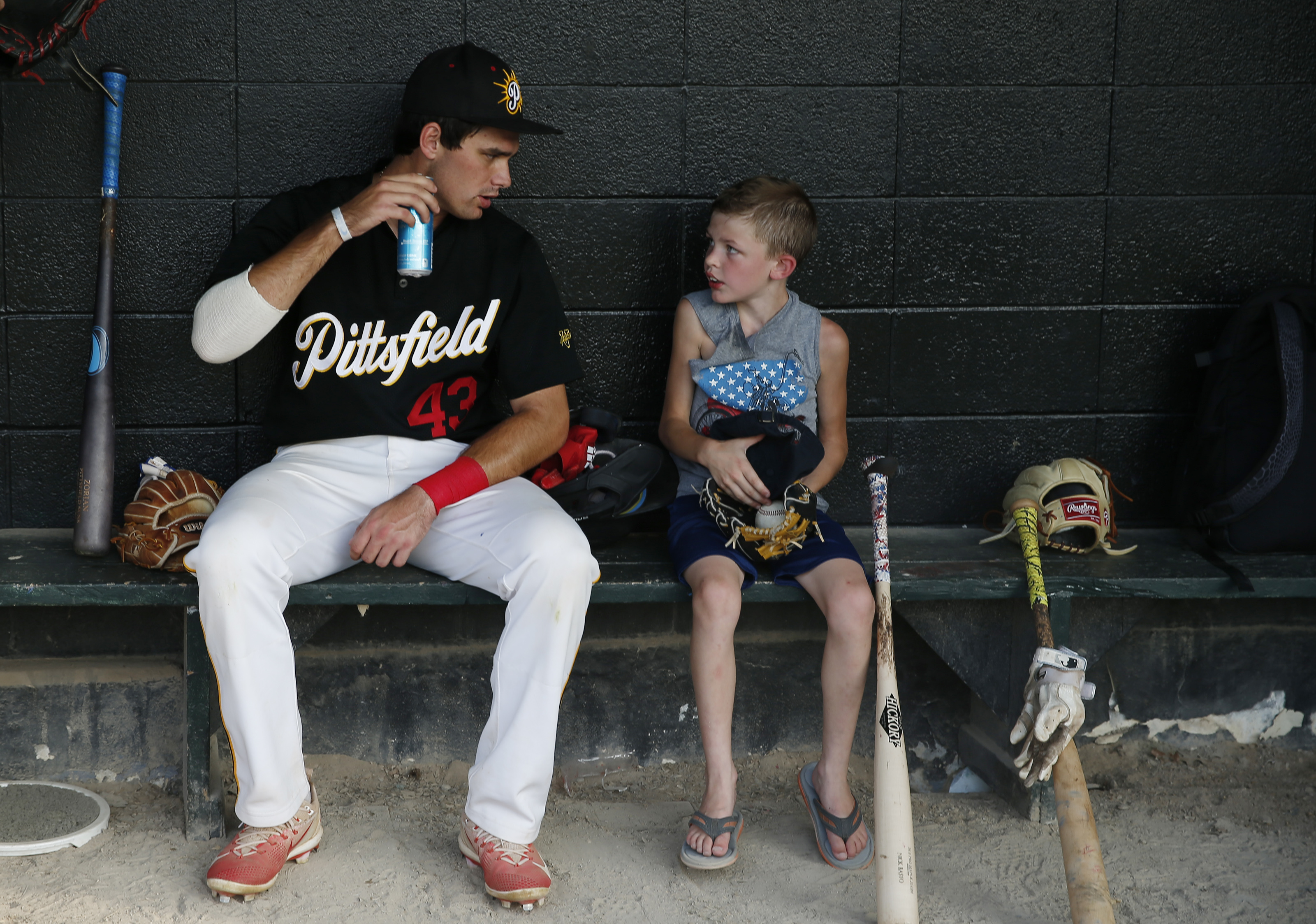 Jaxxon Hand, 8, of Dalton (right) chatted with Pittsfield Suns player Connor Berry before the July 10 game between the Suns and the North Shore Navigators at Wahconah Park in Pittsfield, which is turning 100 this year.