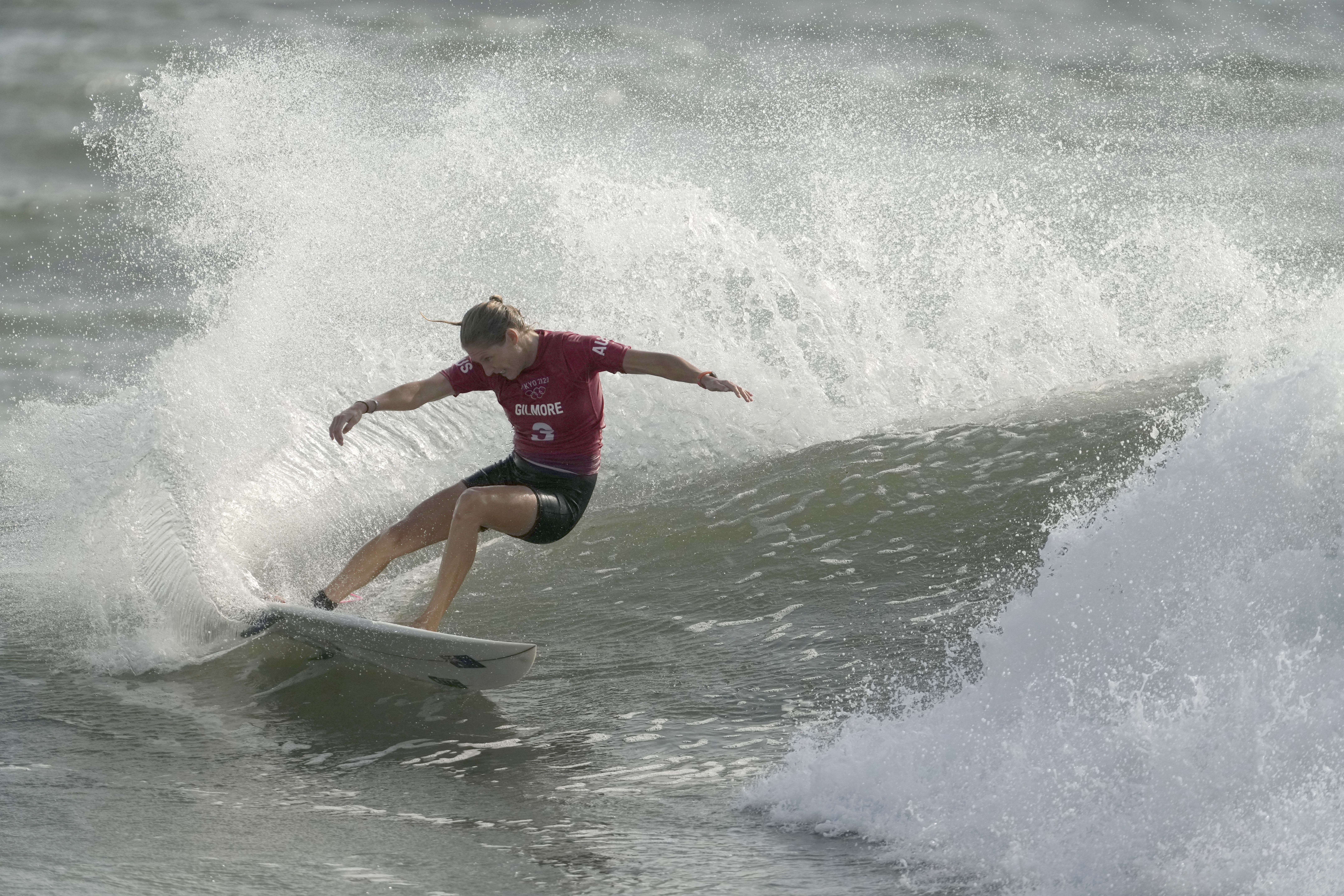 Australia's Stephanie Gilmore maneuvers on a wave during third round of women's surfing competition at Tsurigasaki beach in Ichinomiya.