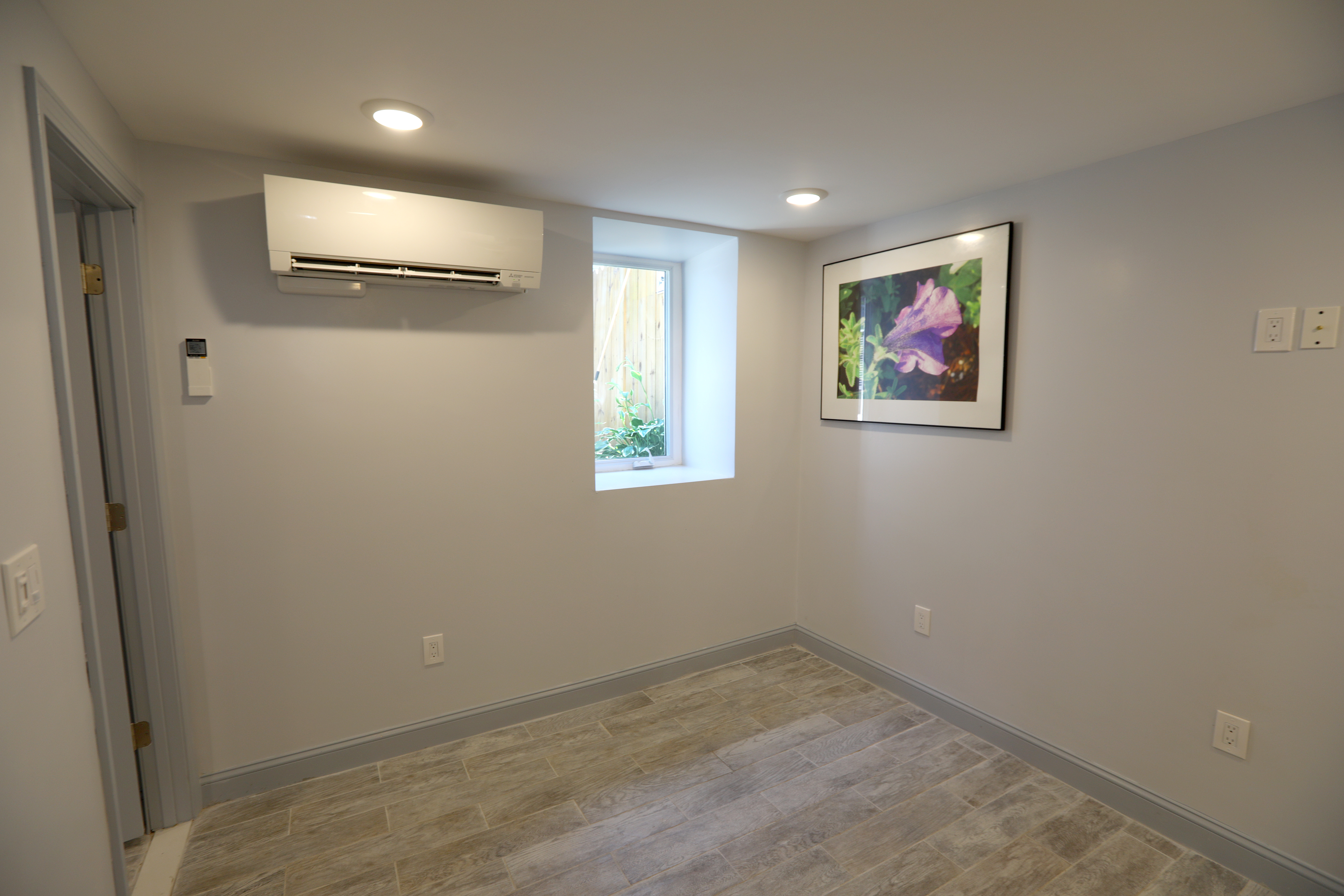 The living-dining area in Wesley Williams Jr.'s converted basement.