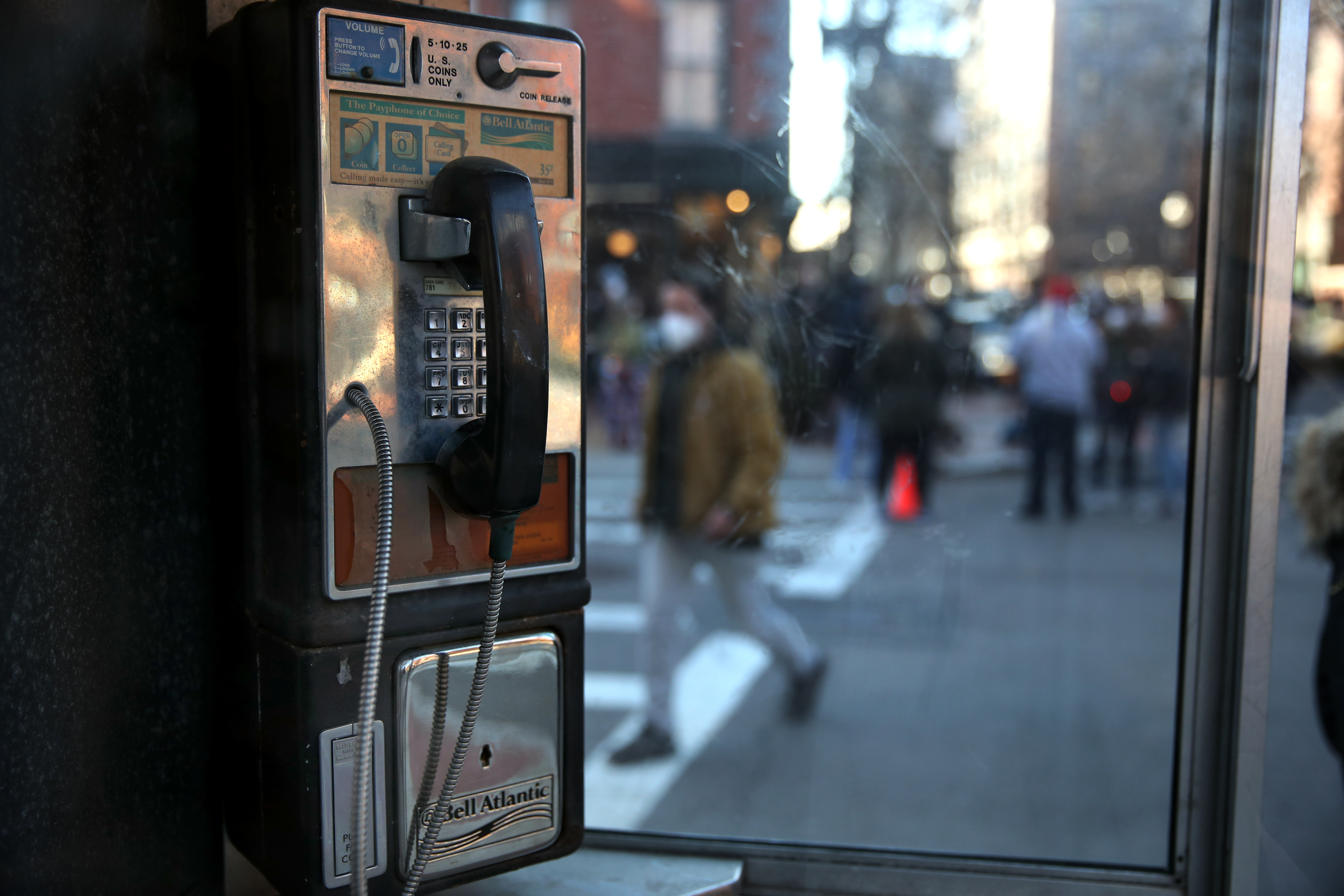 A phone booth is used while filming a scene for "The Tender Bar."