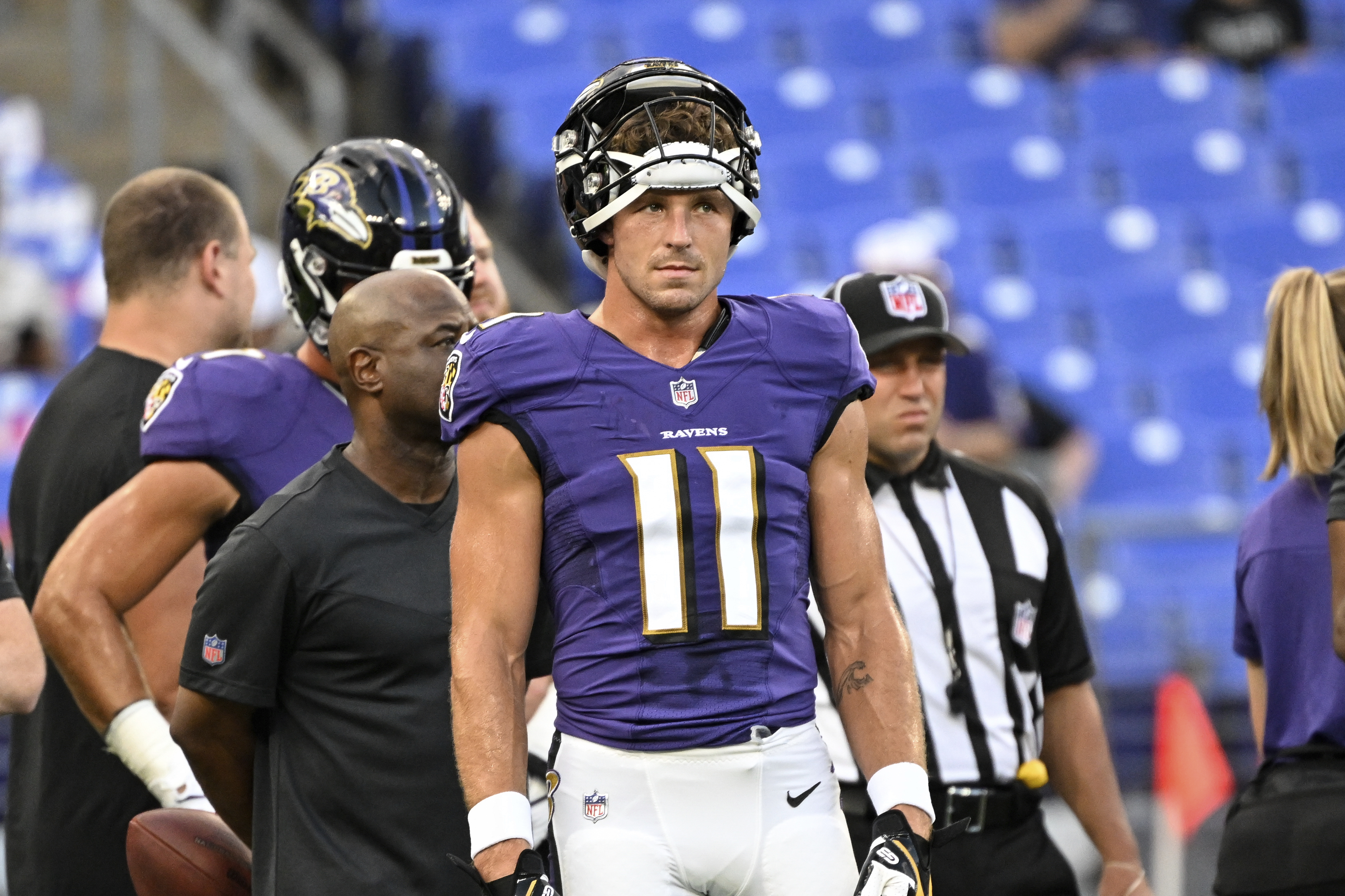 Fan swings helmet at Cowboys' Webb during practice fight; Webb