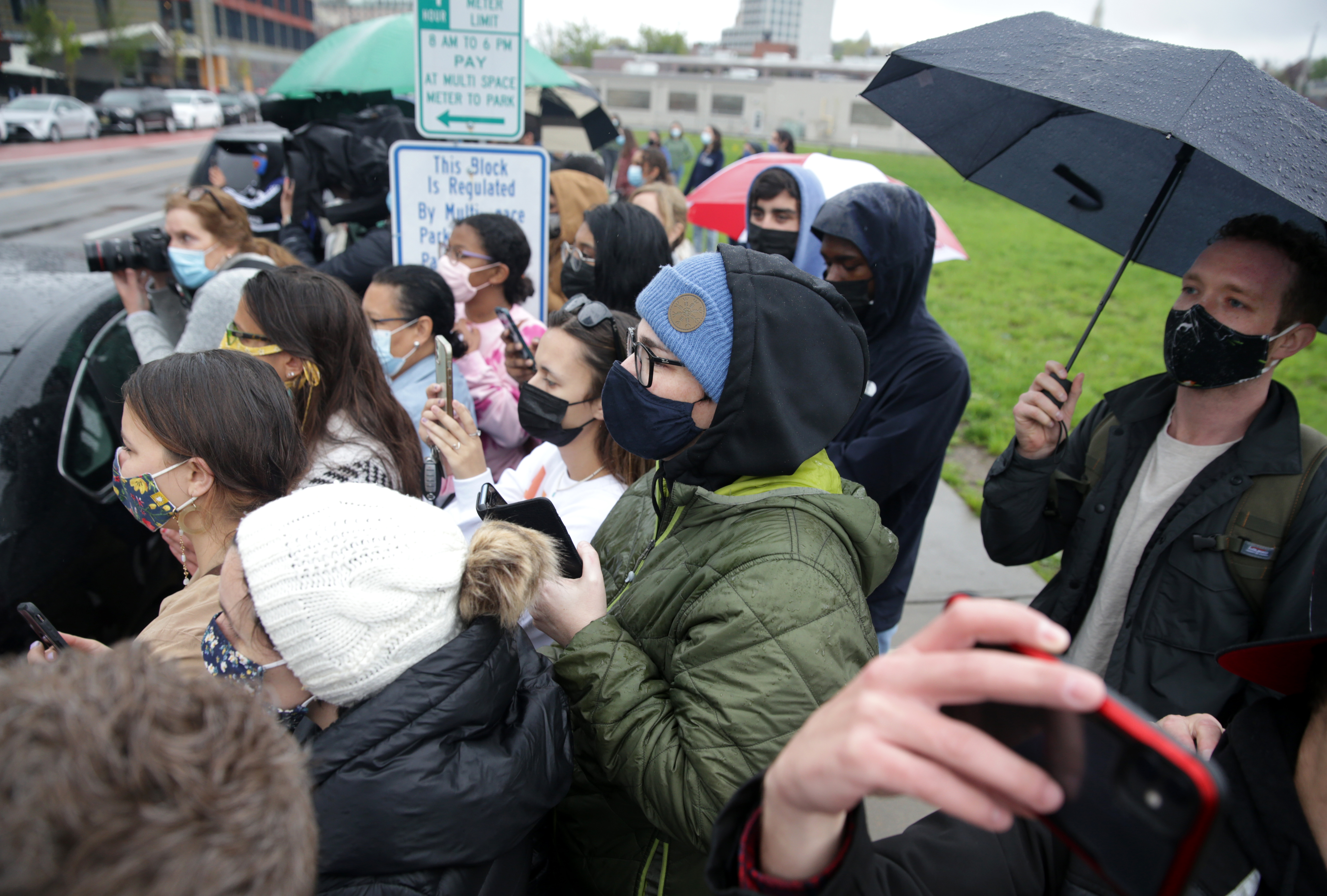 People in Providence try to get a glimpse of Vice President Kamala Harris during one of her stops in Providence.