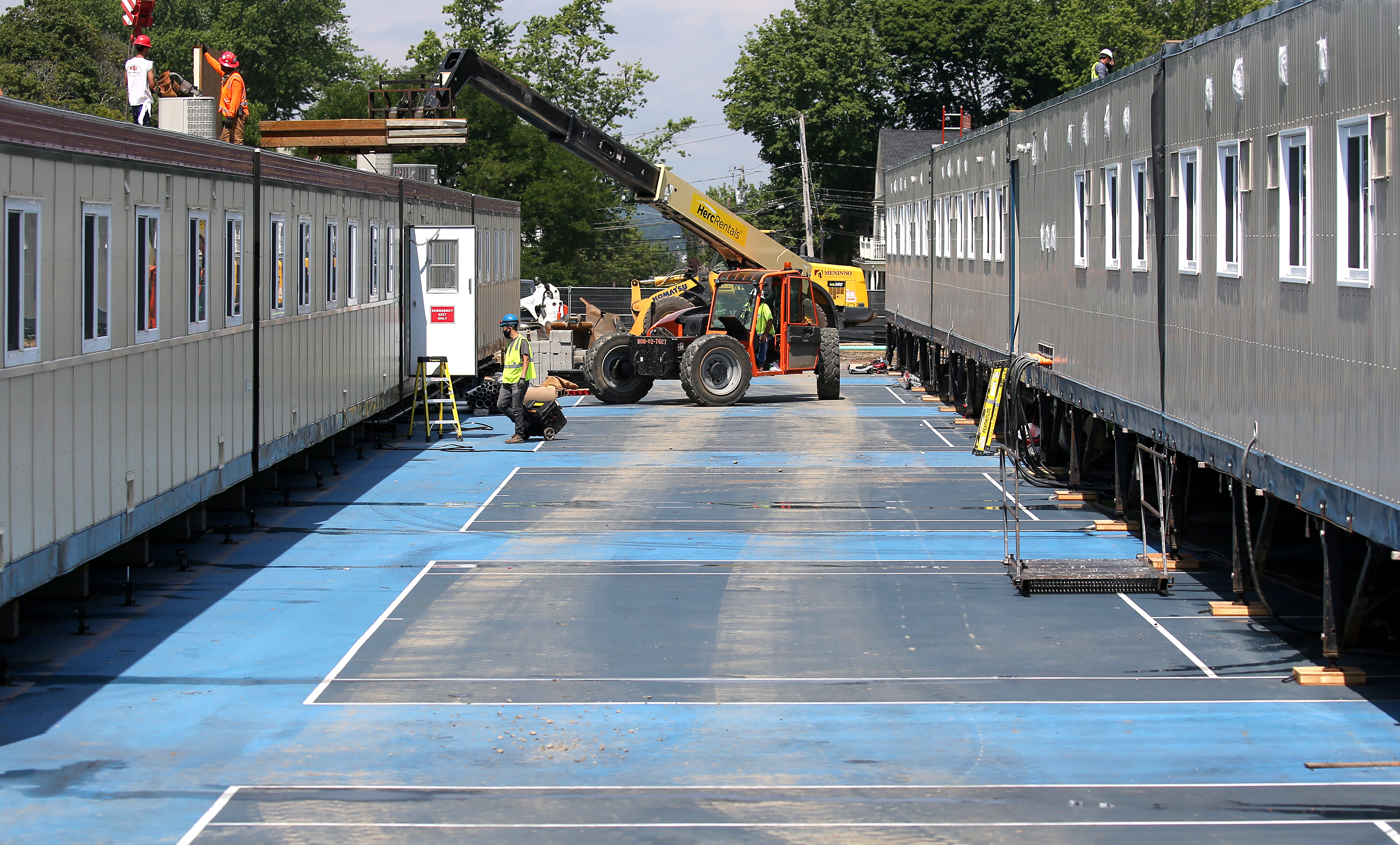 The construction site of temporary dorms to house quarantined on the Tufts University tennis courts in Medford.
