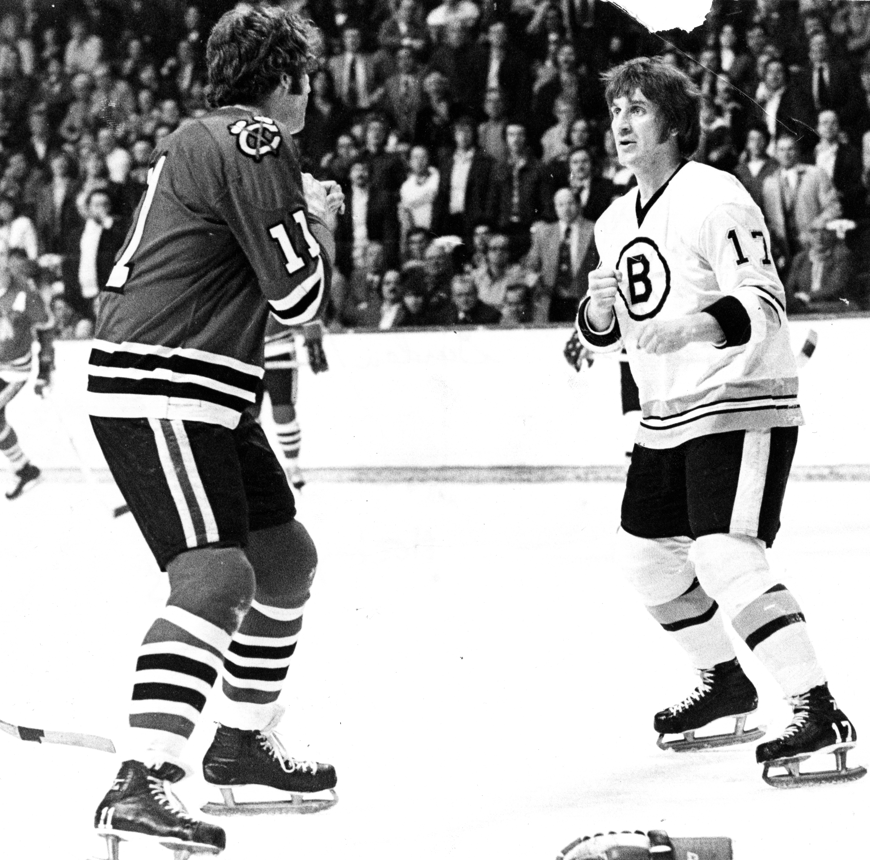 Mr. Schmautz, squaring off against Chicago Black Hawks' John Marks during Game One of the first round of the 1975 Stanley Cup playoffs at the Boston Garden. Although he was small, the former Bruin was known for his scrappy approach to the game.
