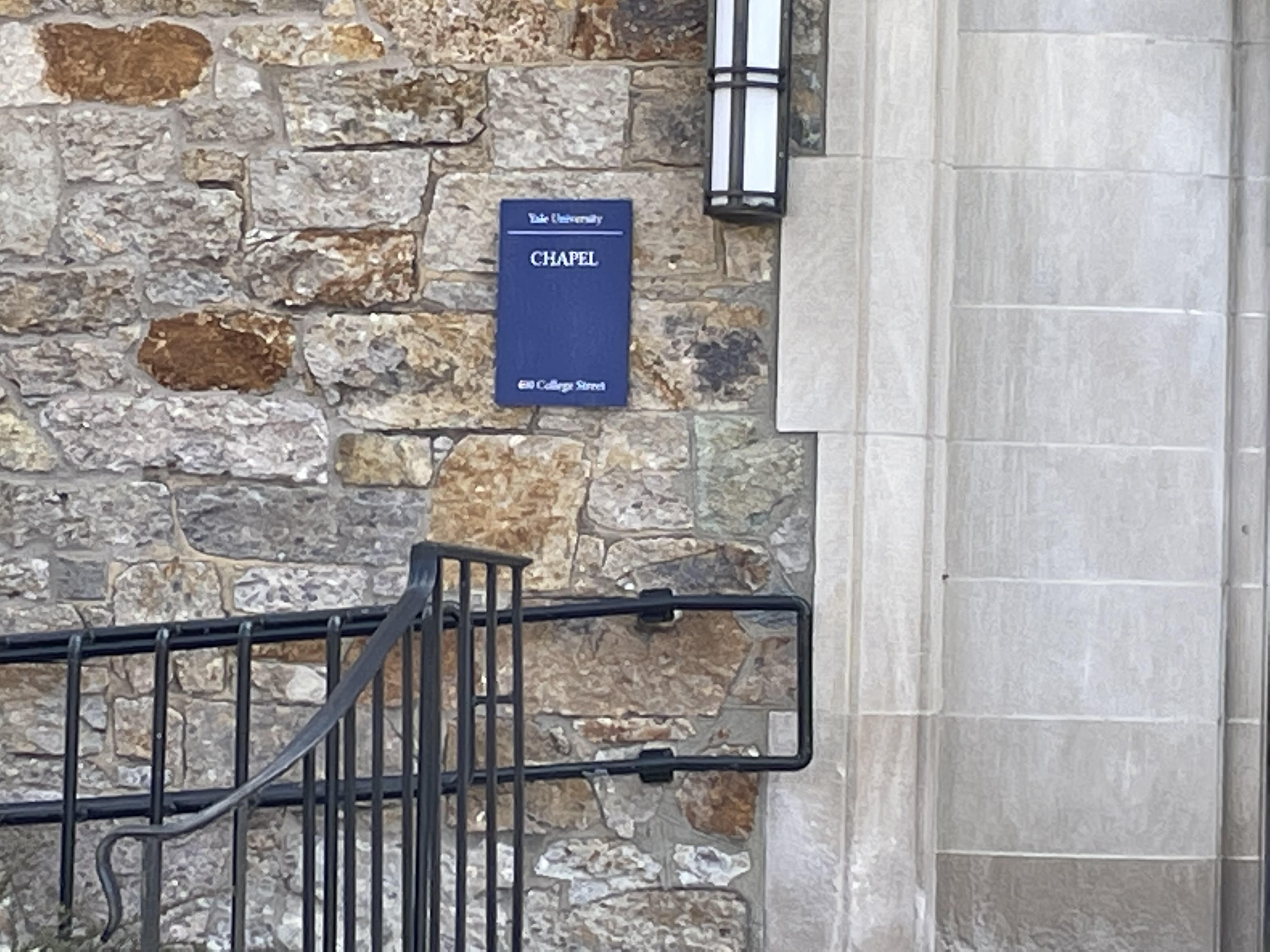 A sign that said "Yale University" was placed on a chapel in Cambridge.