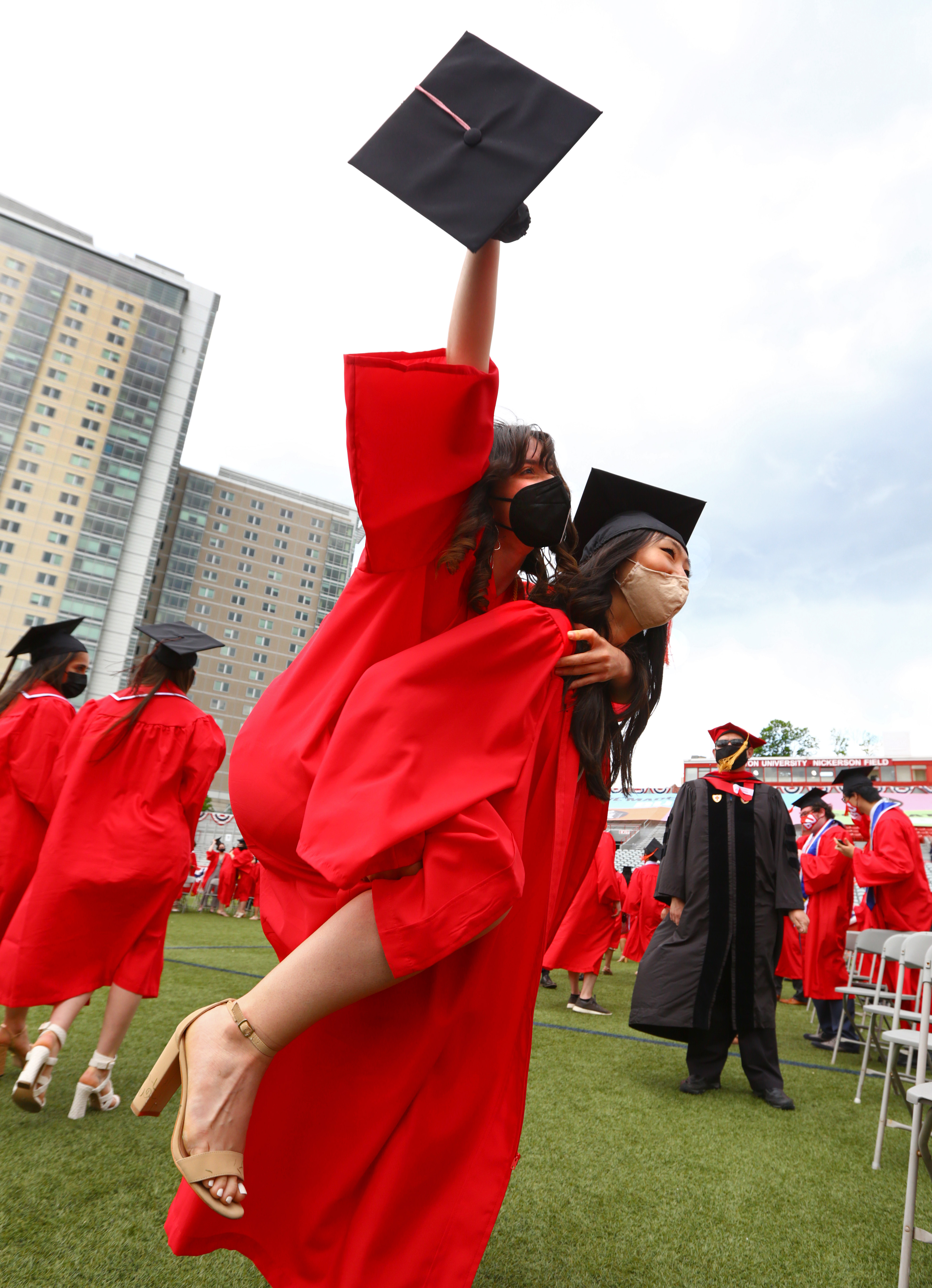 After the ceremony, Nadya Rachid celebrates with a piggy-back ride on Saejin Yoo.
