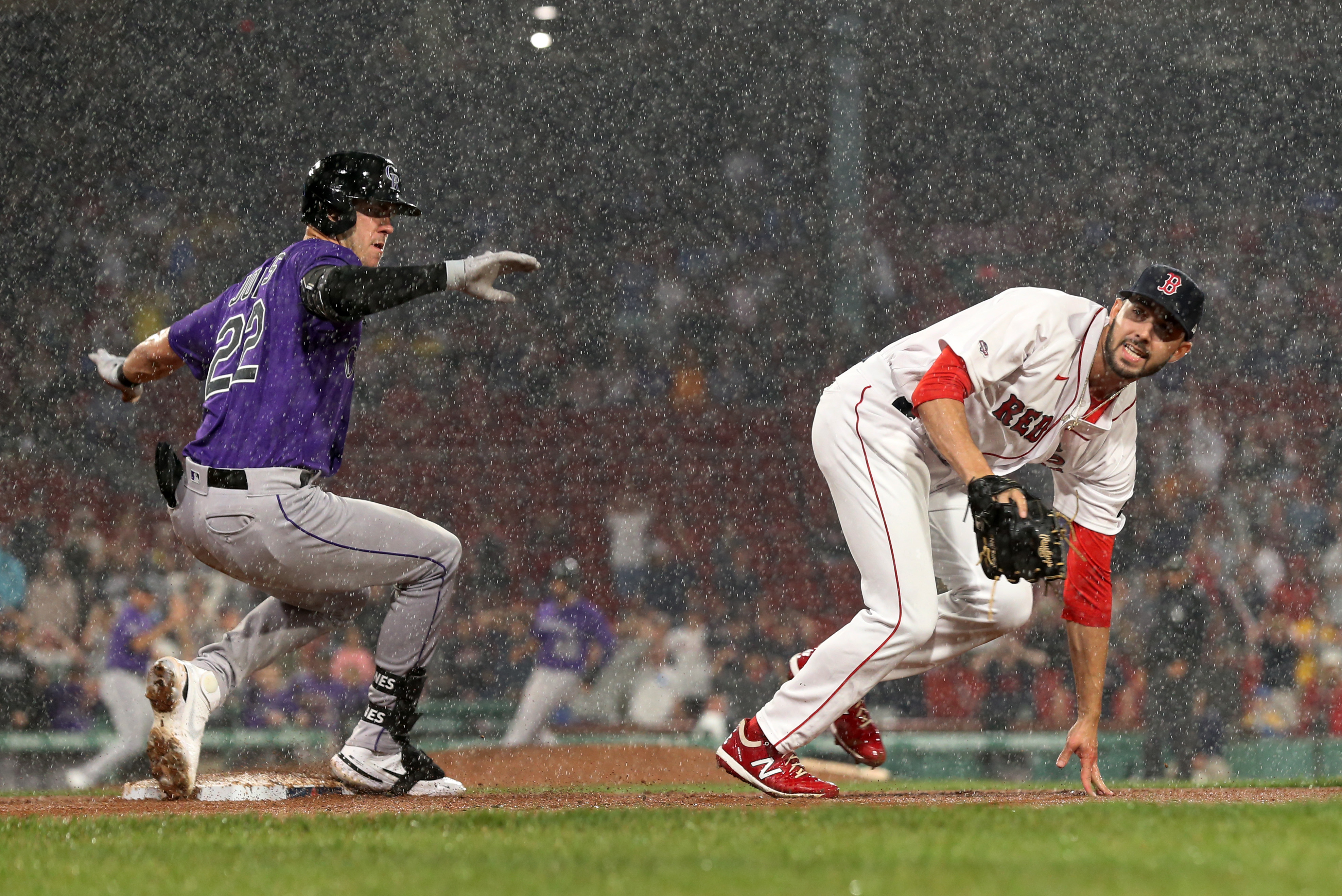 Rockies beat sloppy Red Sox 4-3 in 10 after rain delay