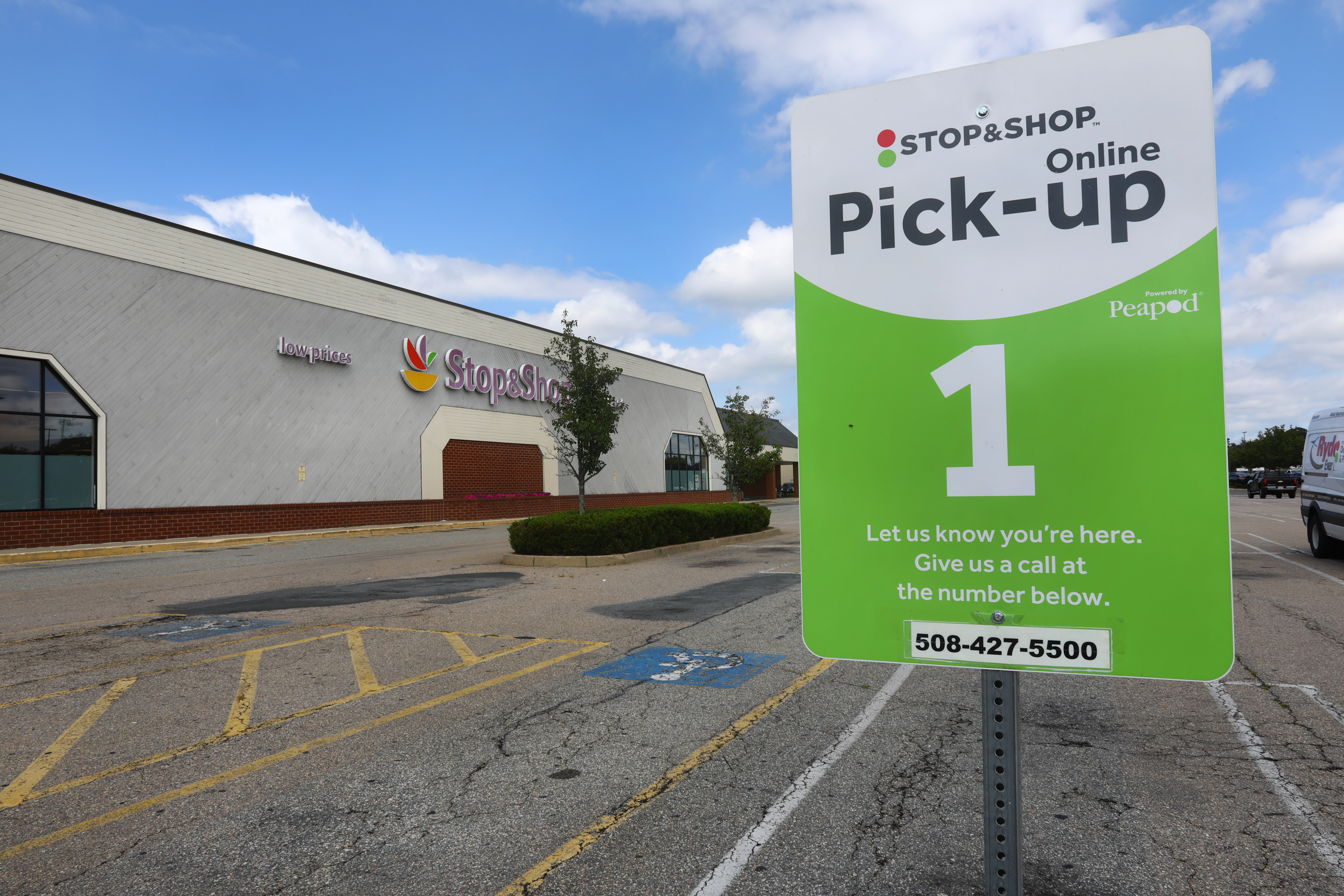 There are parking spaces designated for picking up groceries.