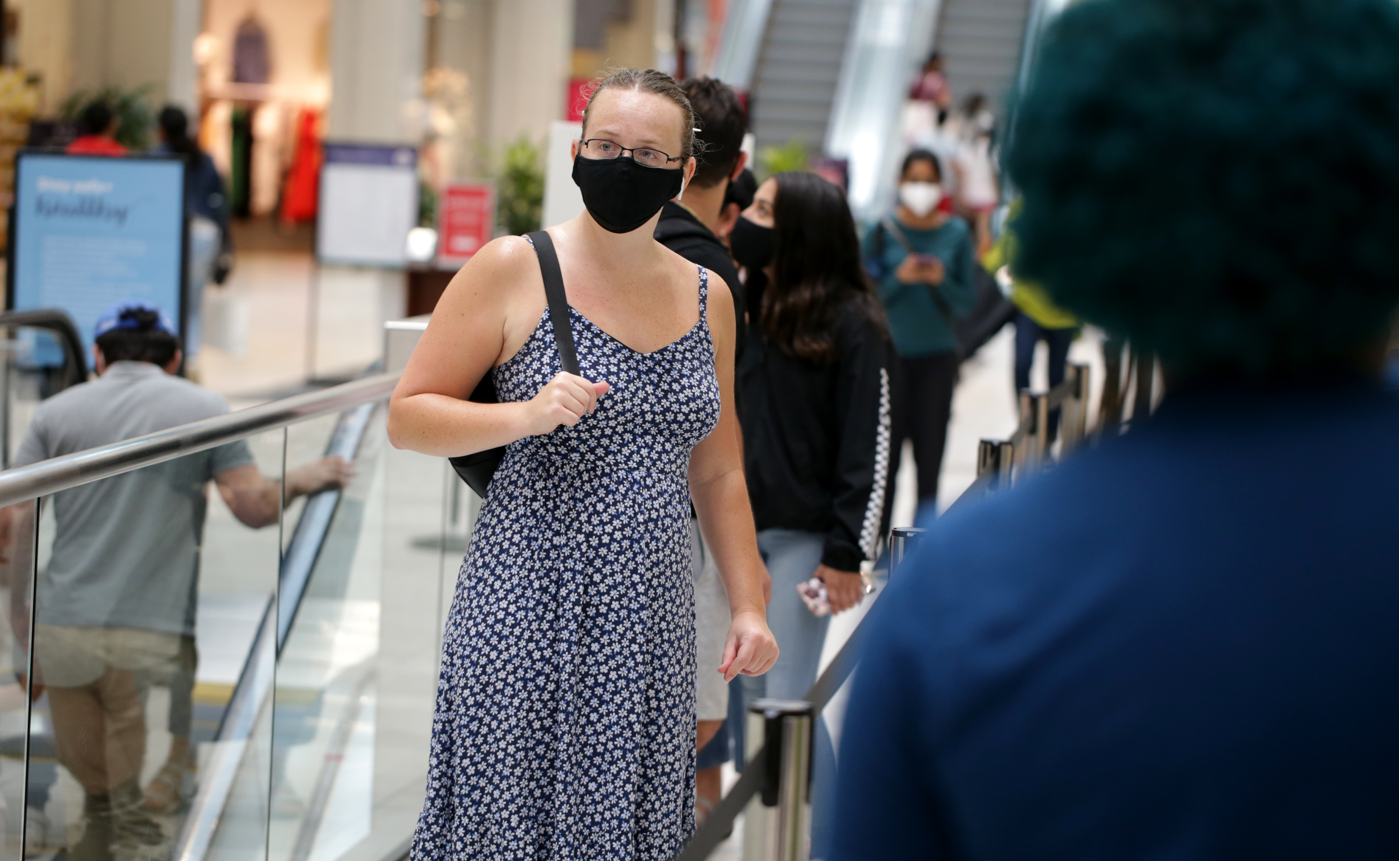 Rebecca Thompson (cq) left waited on line to shop at the Apple store during Tax free weekend.