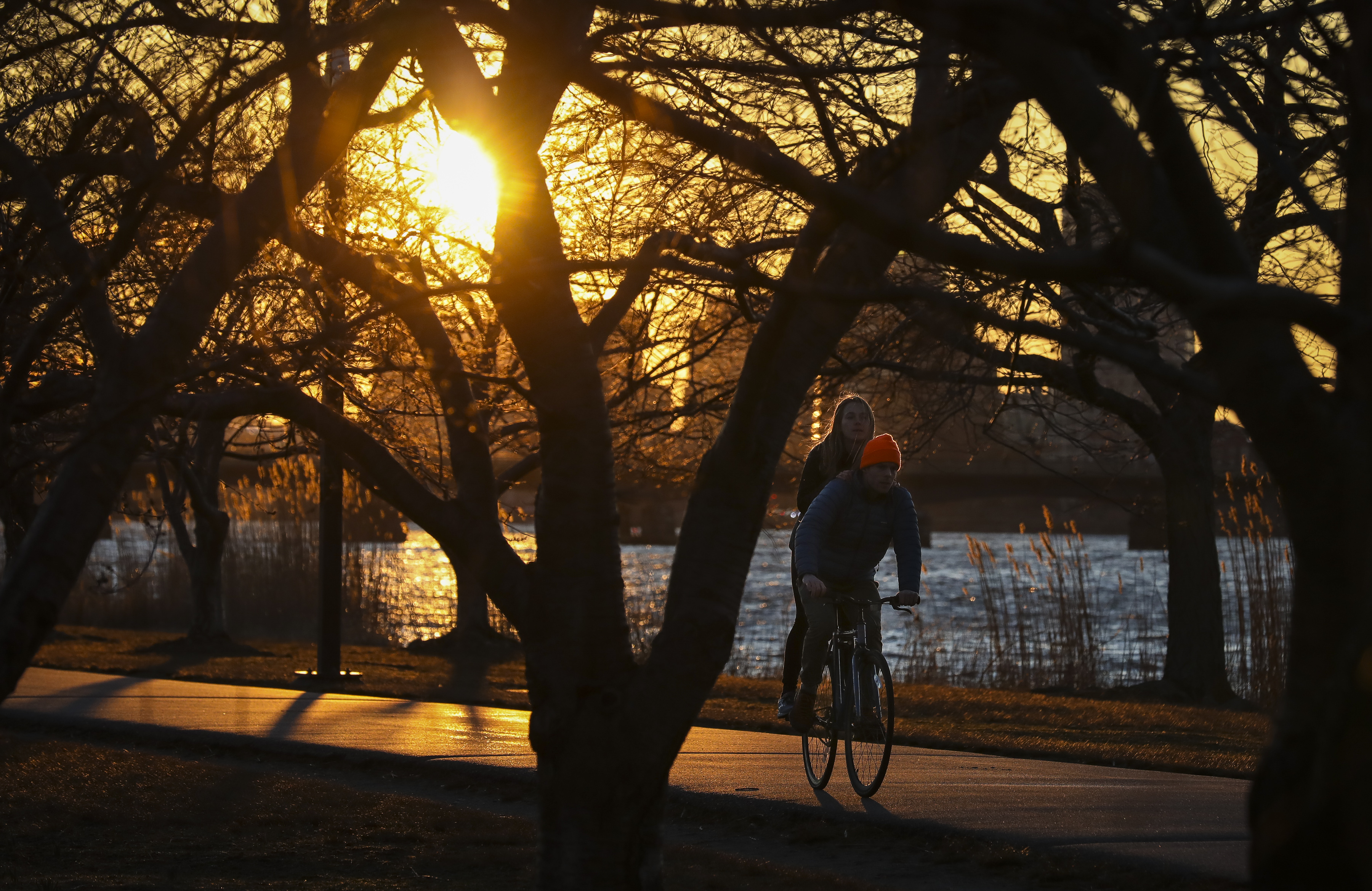 A couple cruises down the bike path on the Charles River Esplanade earlier this year.